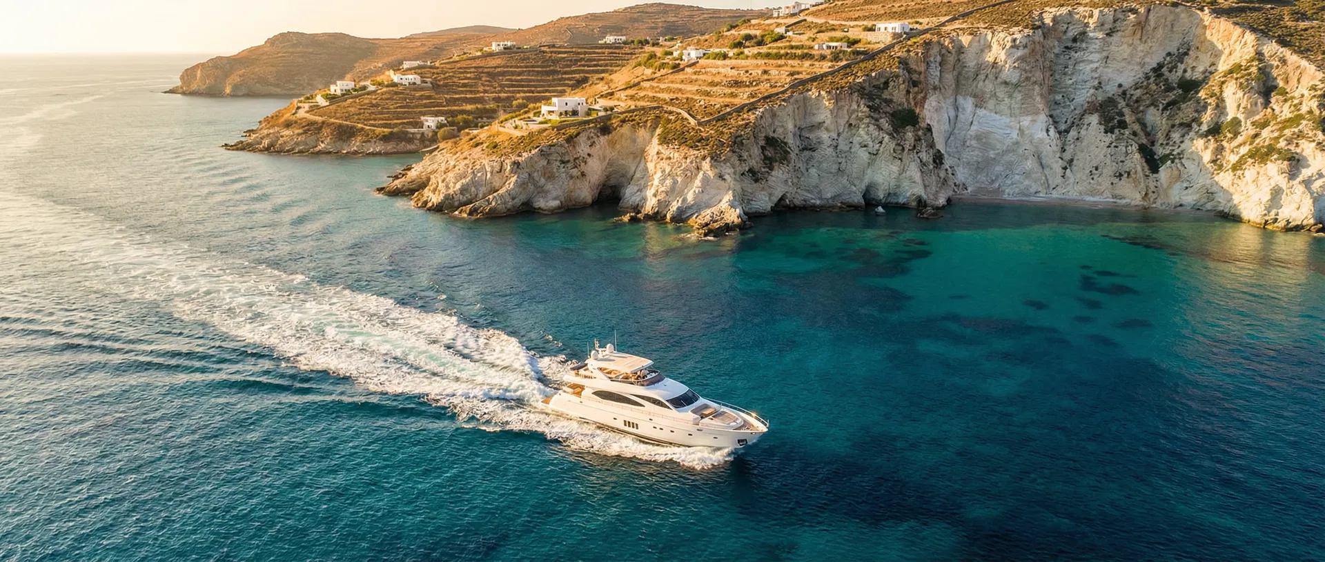 Luxury yacht cruising through turquoise Mediterranean waters