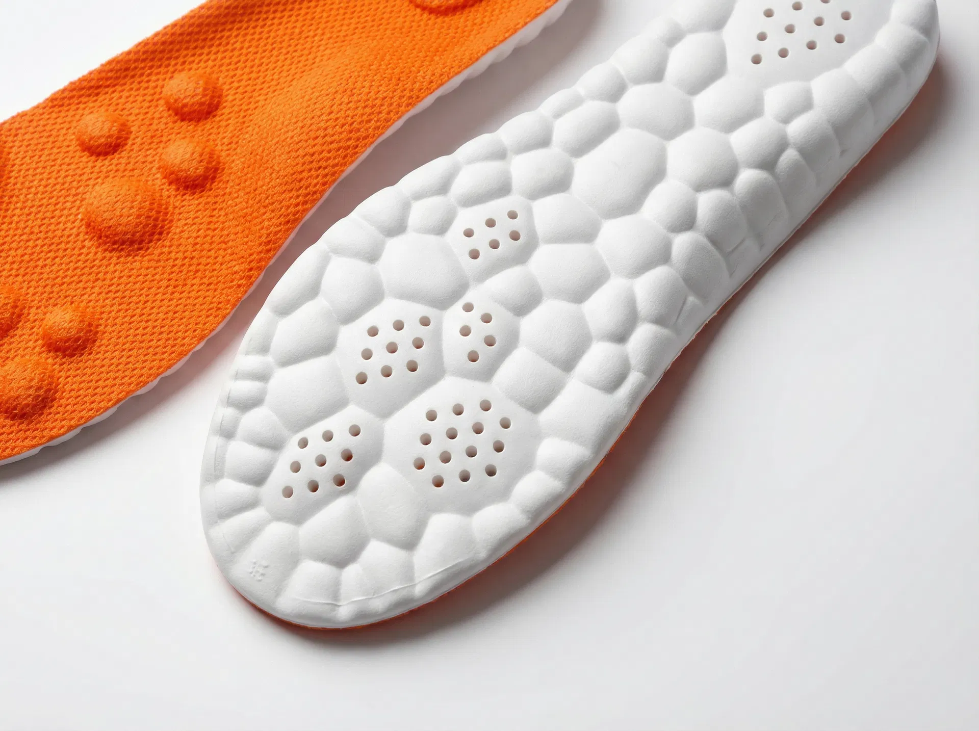 Close-up of Stepprs insole white underside showing cushioning bubbles and ventilation holes