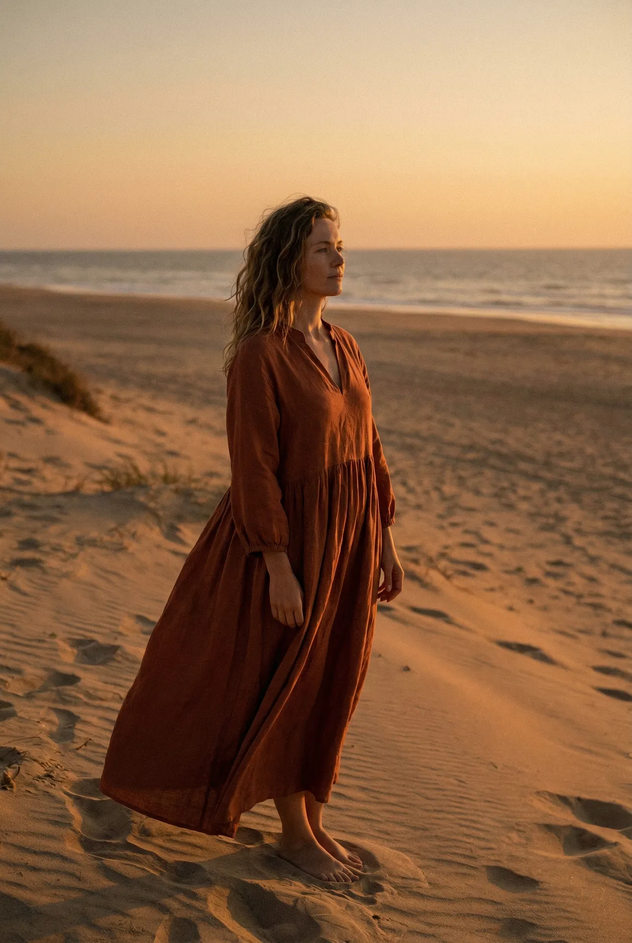 Woman at golden hour beach