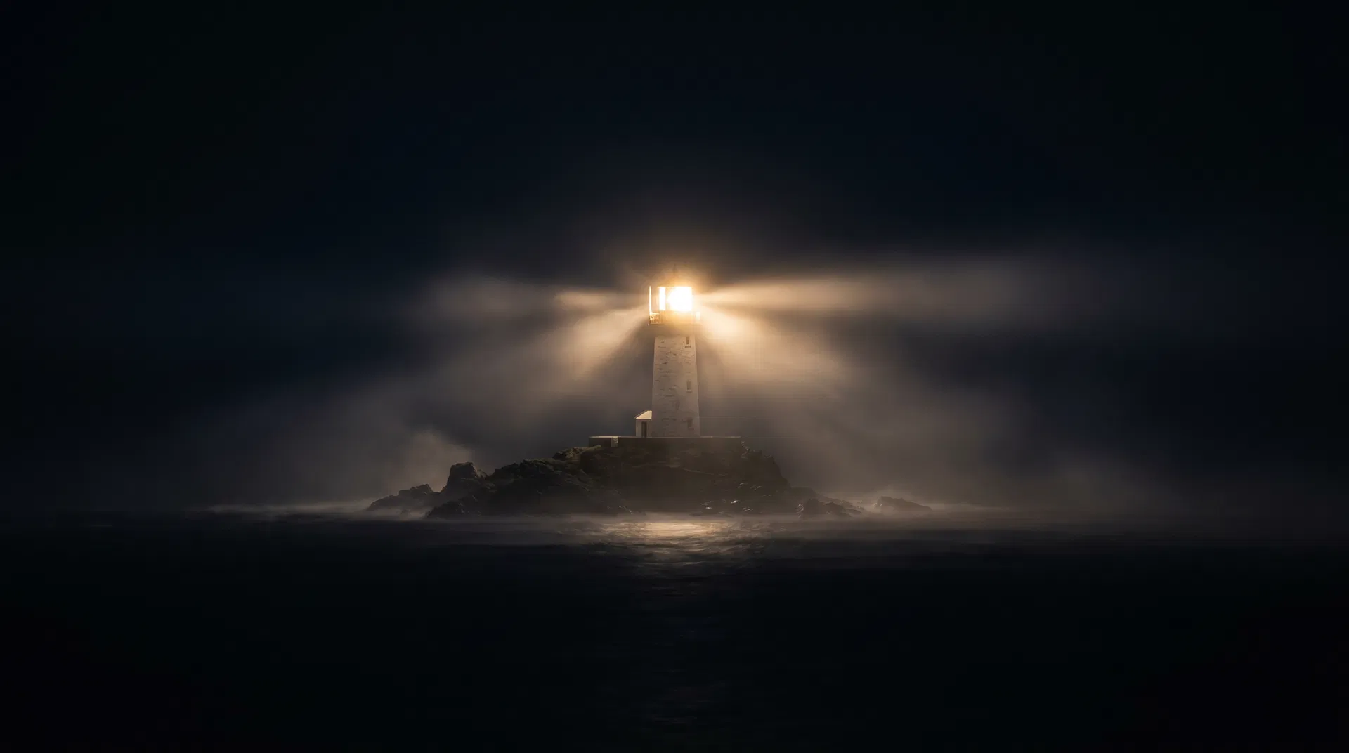 Lighthouse beam cutting through darkness