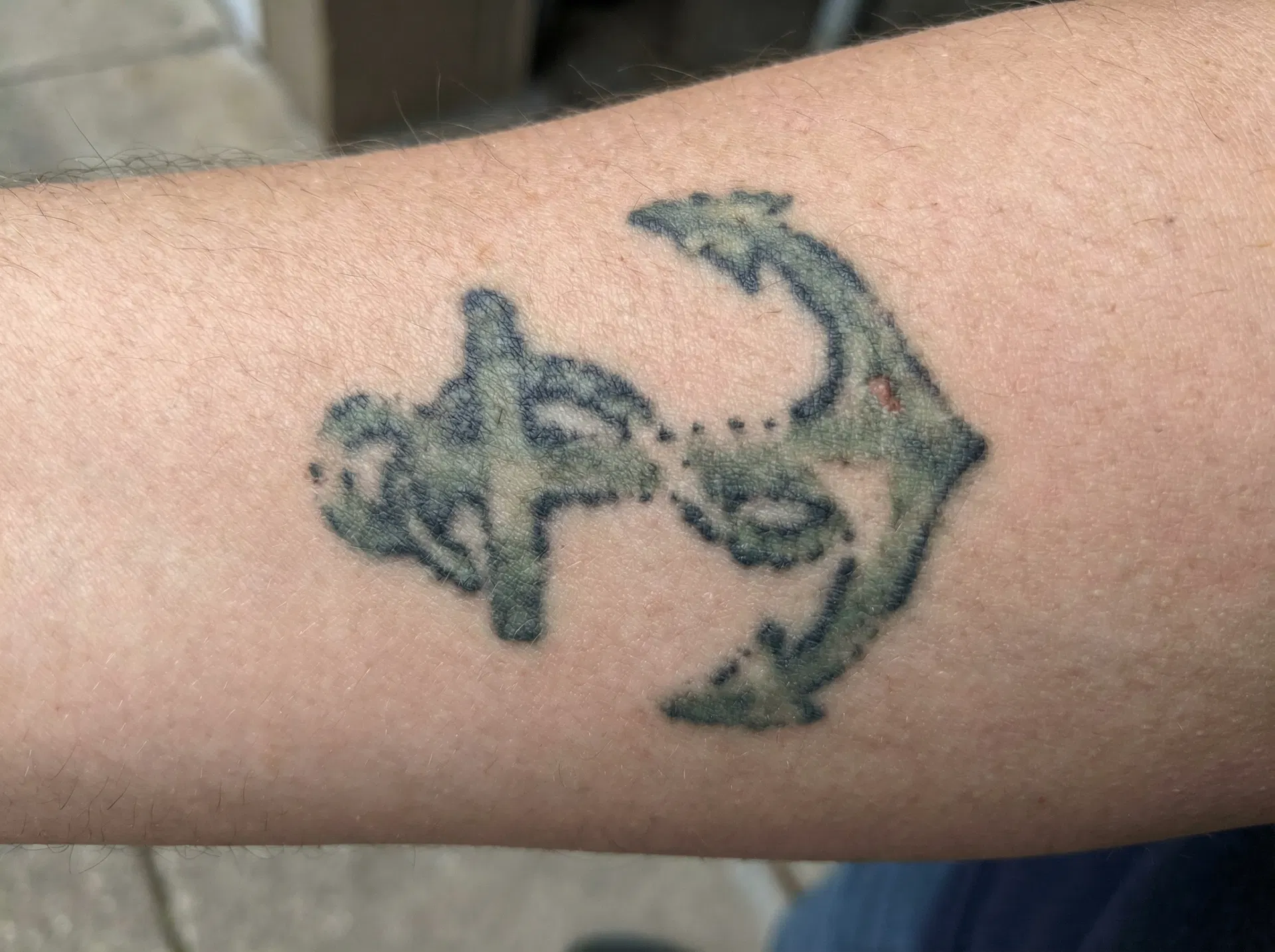 Low quality blurry tattoo