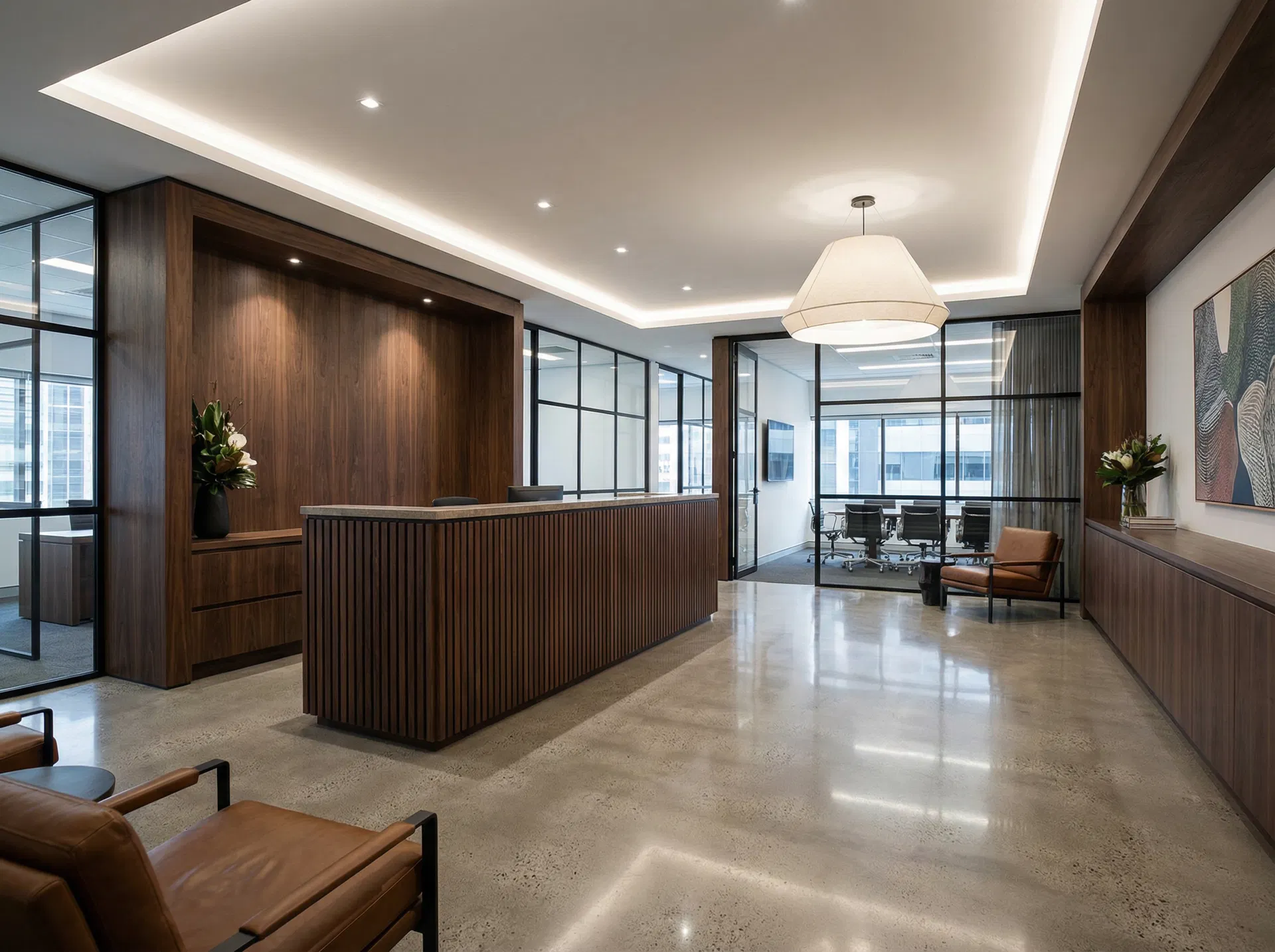 Commercial office fit-out with bespoke walnut joinery, reception desk and glass partitions by Ross-Read Carpentry Poole