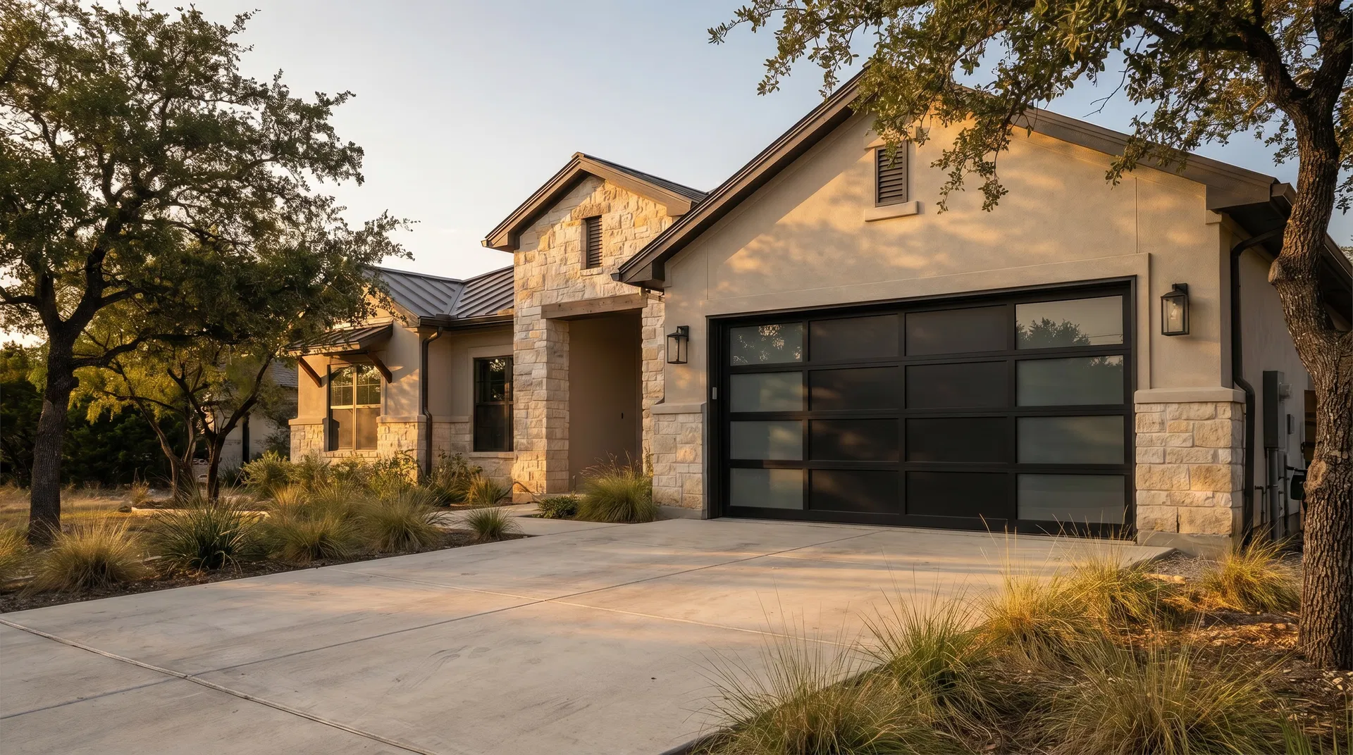 New black garage door installed at a stone-front Texas home