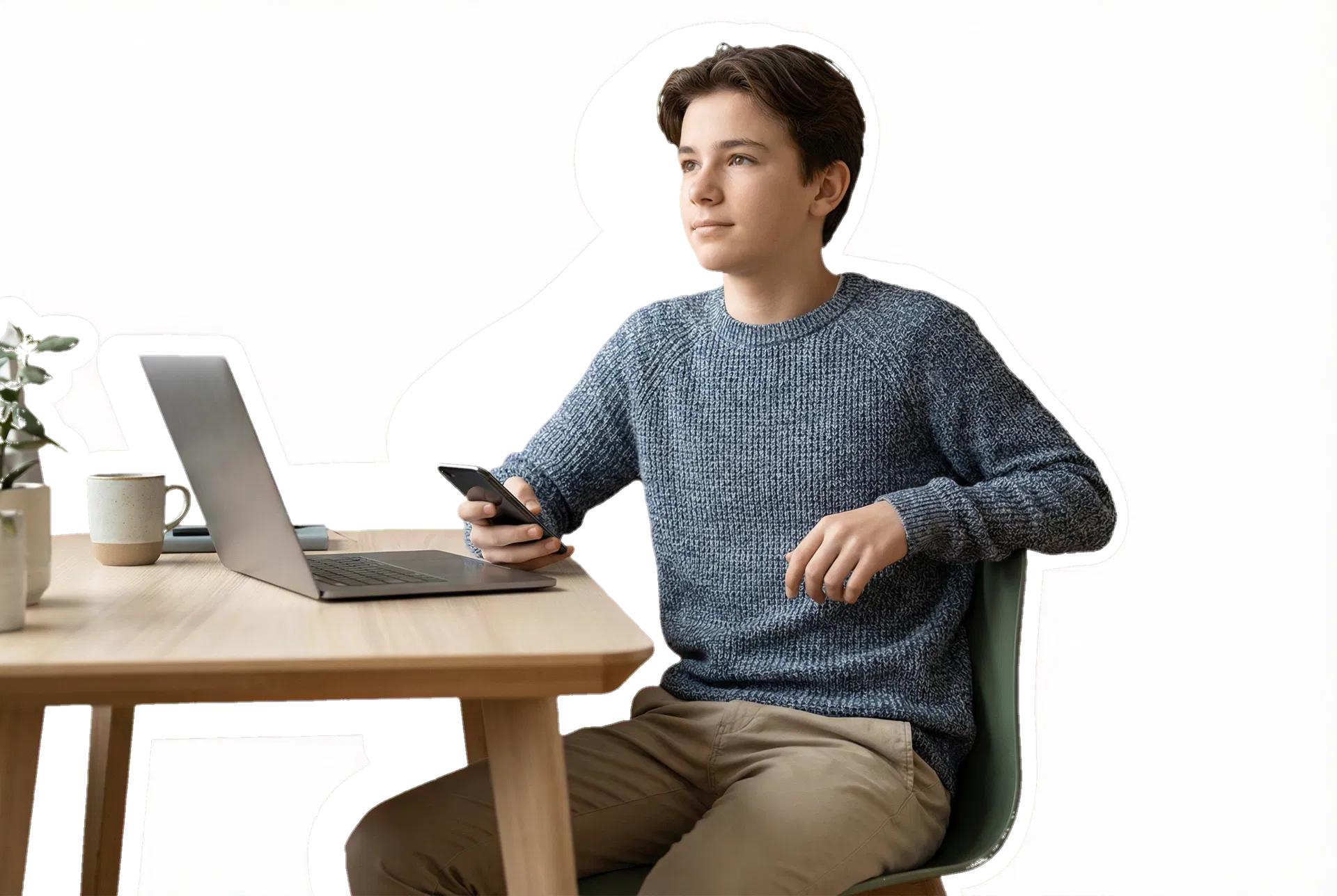 Adolescent à son bureau avec ordinateur et téléphone dans un cadre domestique apaisé