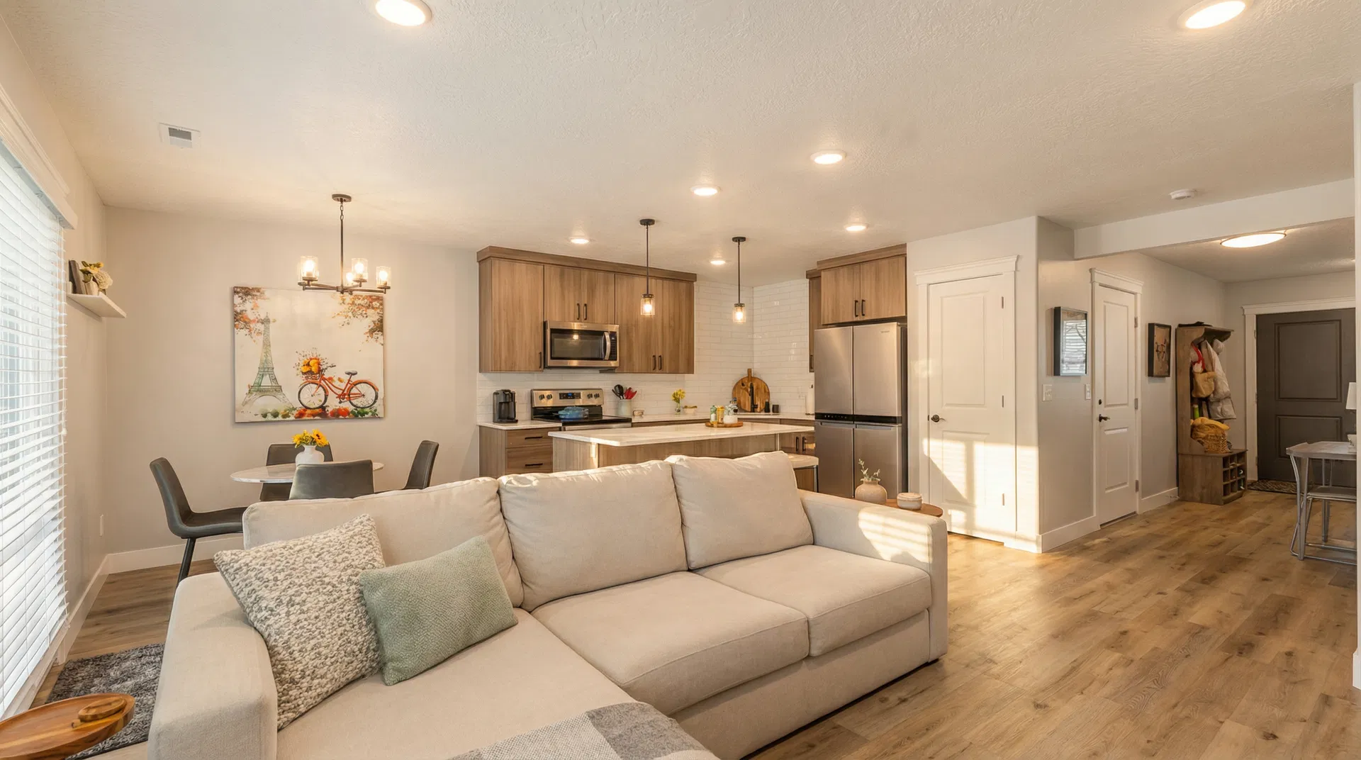 Open-concept living and kitchen with warm natural light