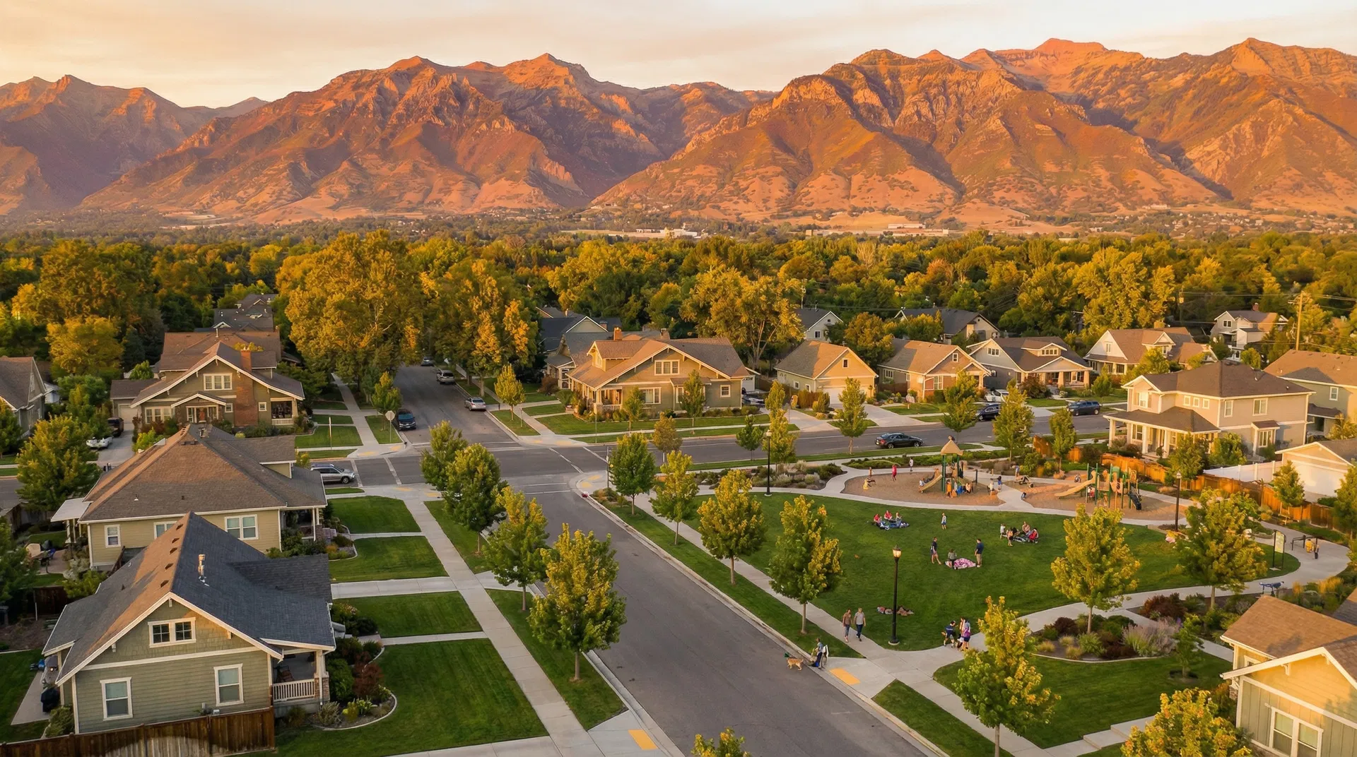 Aerial view of Kaysville, Utah with Wasatch Mountains at golden hour