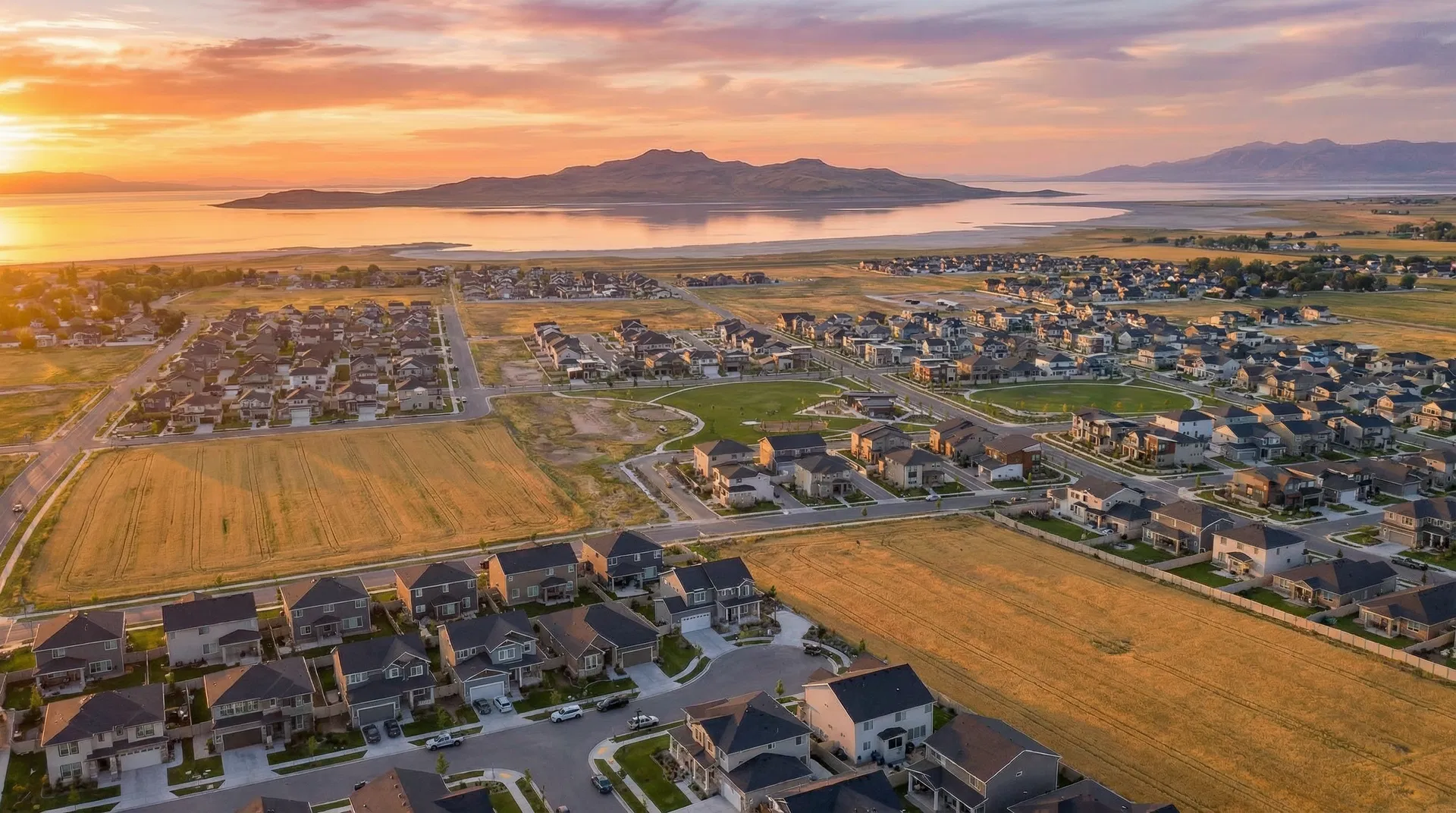 Aerial view of West Haven, Utah with Great Salt Lake at golden hour