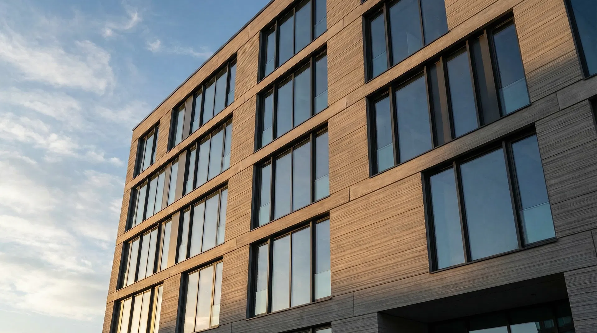 Modern building facade clad in ViViD UHPC wood grain panels