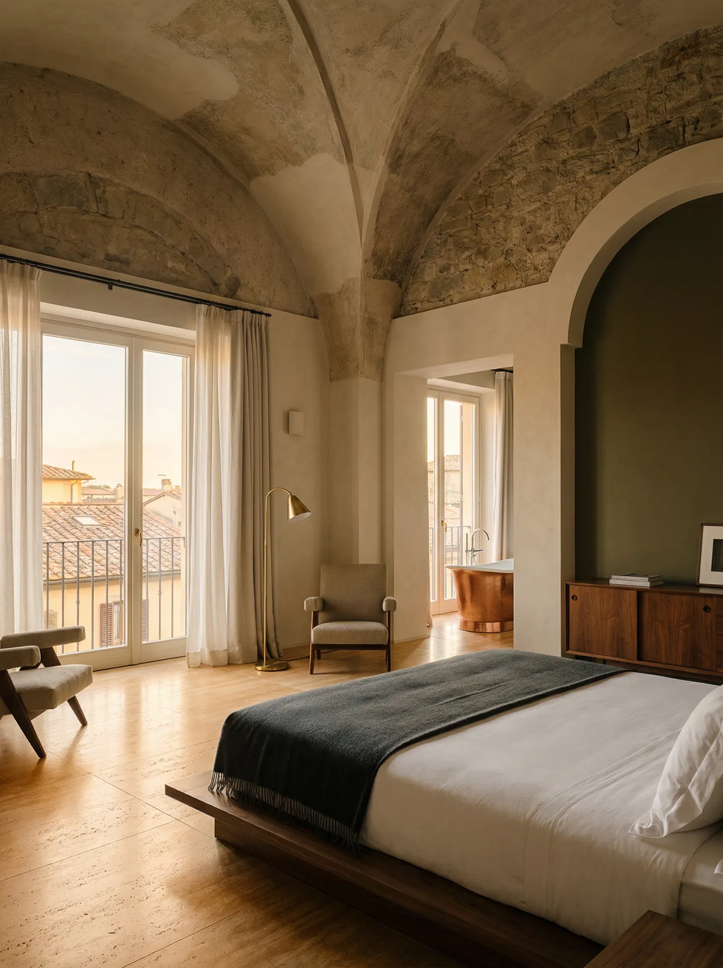 Modern Italian luxury suite with vaulted stone ceilings, copper bathtub, and Italian rooftop views
