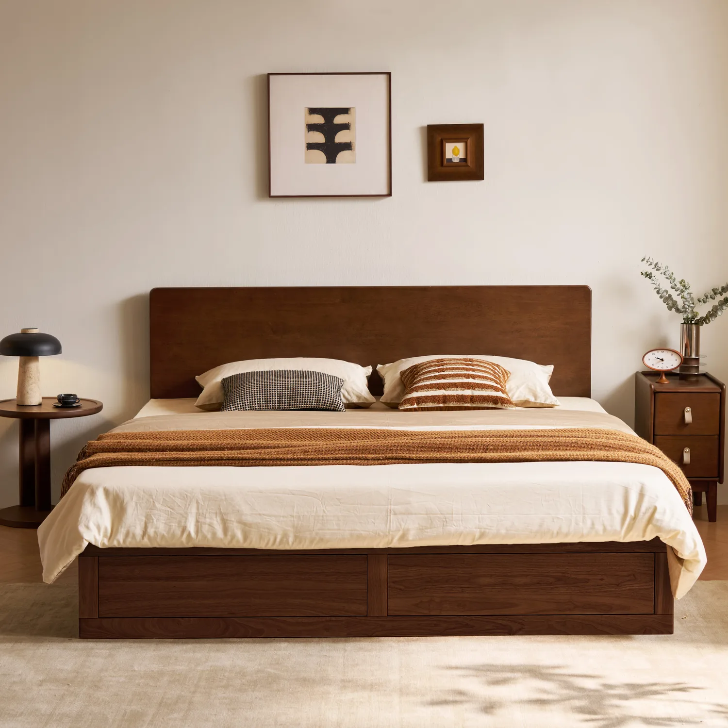 Walnut solid timber headboard with framed wall art above bed
