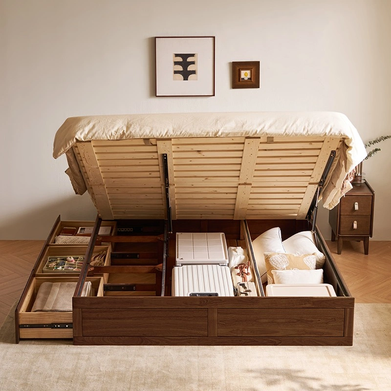 Evelyn gaslift walnut rubberwood bed open to show divided underbed storage compartments and drawers.