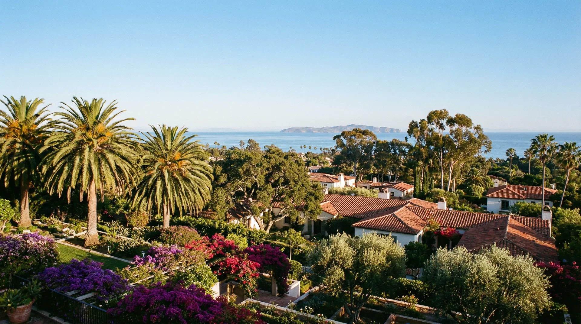 Montecito landscape — Spanish Revival rooftops, palms, and the Pacific Ocean with Channel Islands
