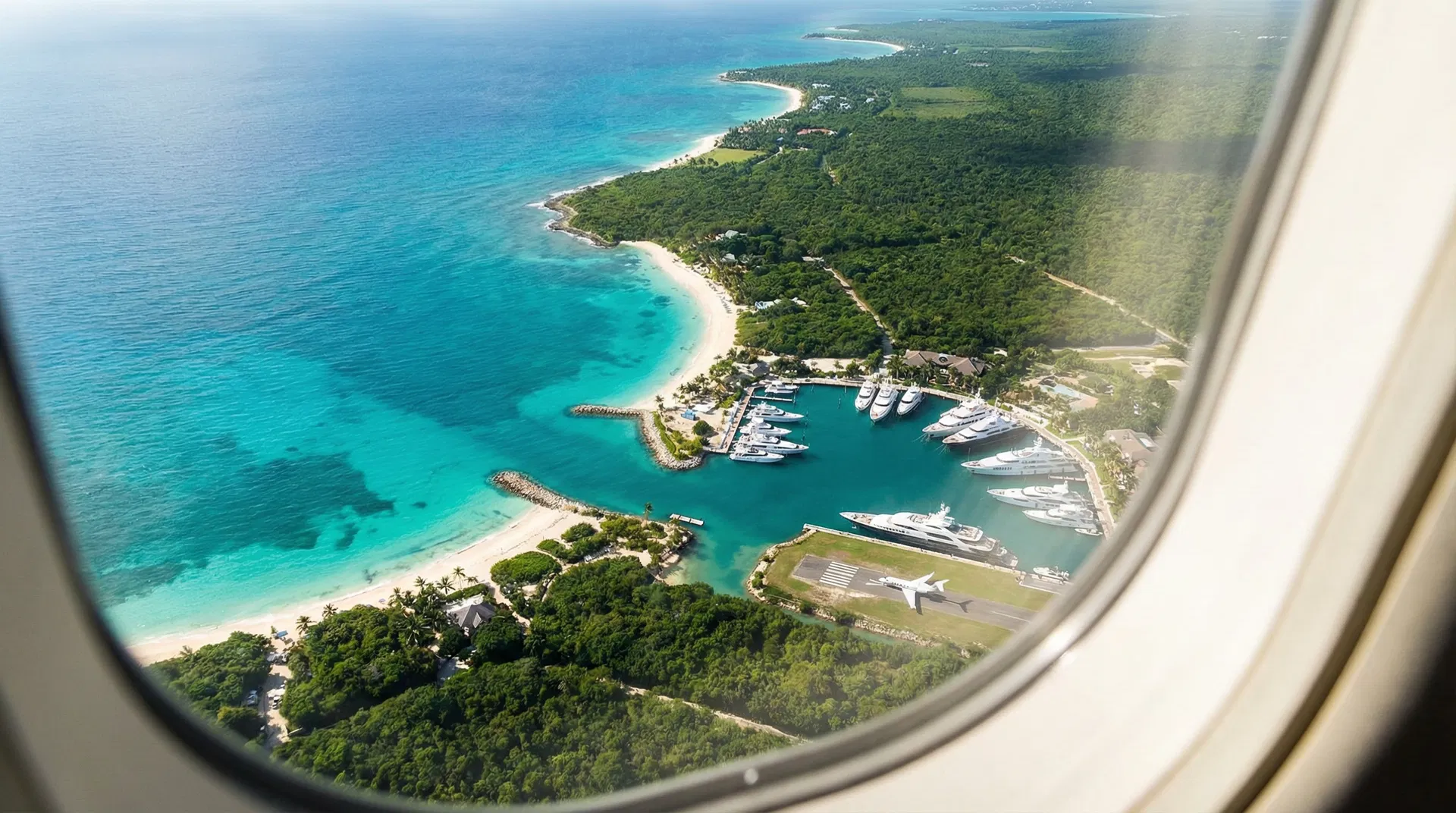 Aerial view of Caribbean coastline from private jet window