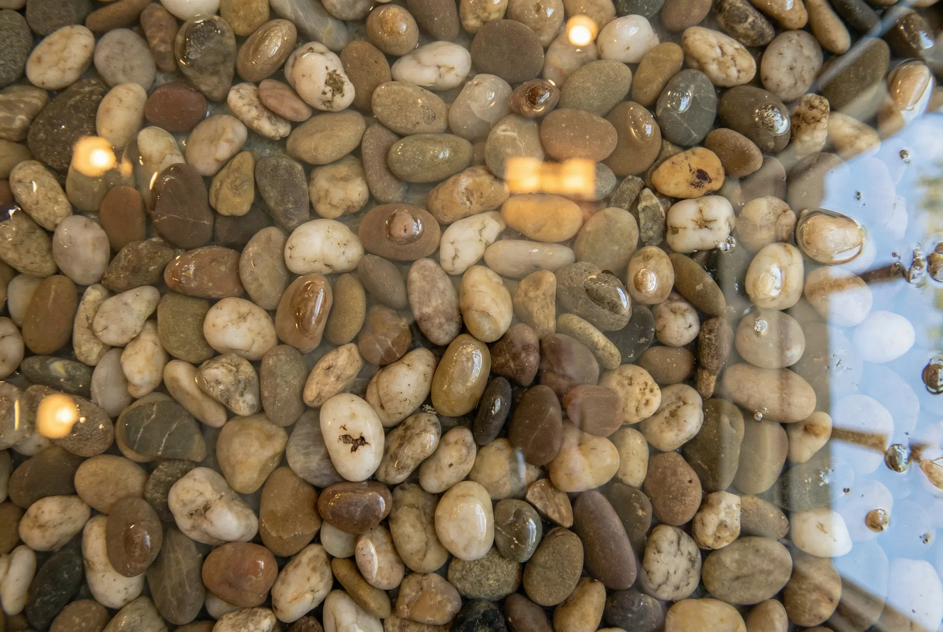 Close-up of river pebble epoxy — warm earth tones