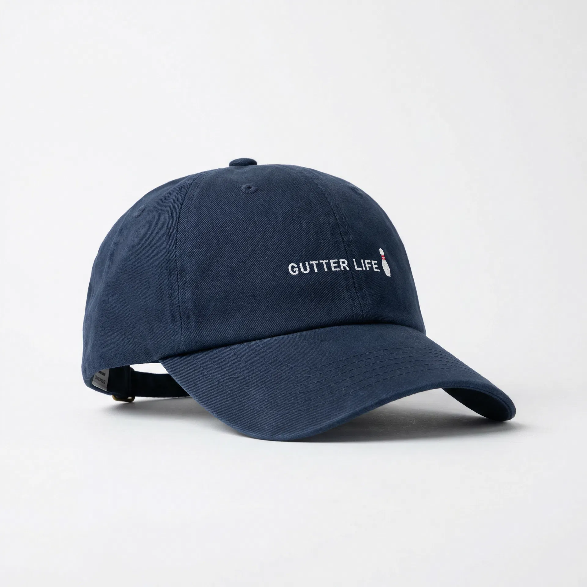 Gutter Life dad hat in navy with bowling pin embroidery