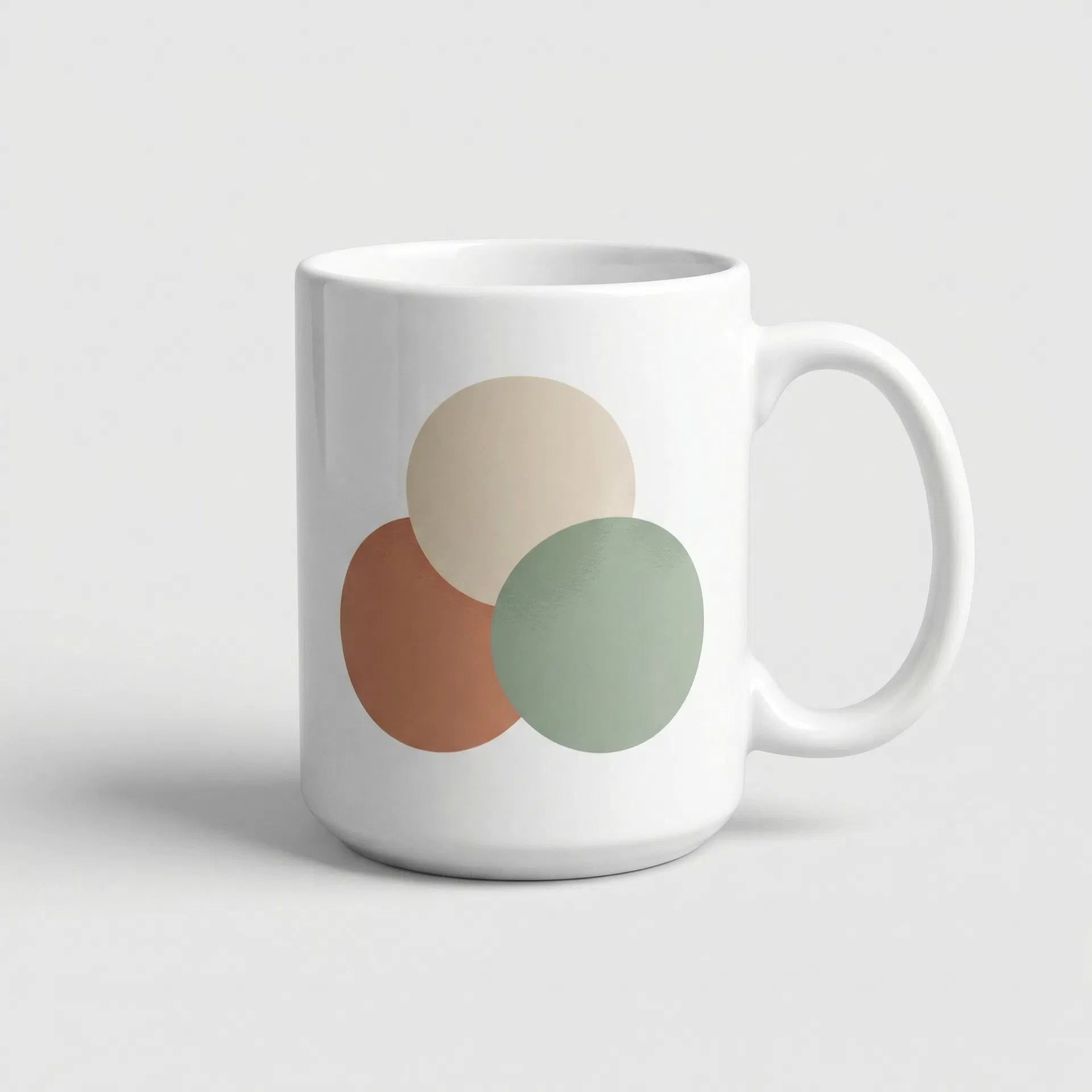 White ceramic mug with minimalist overlapping circles design