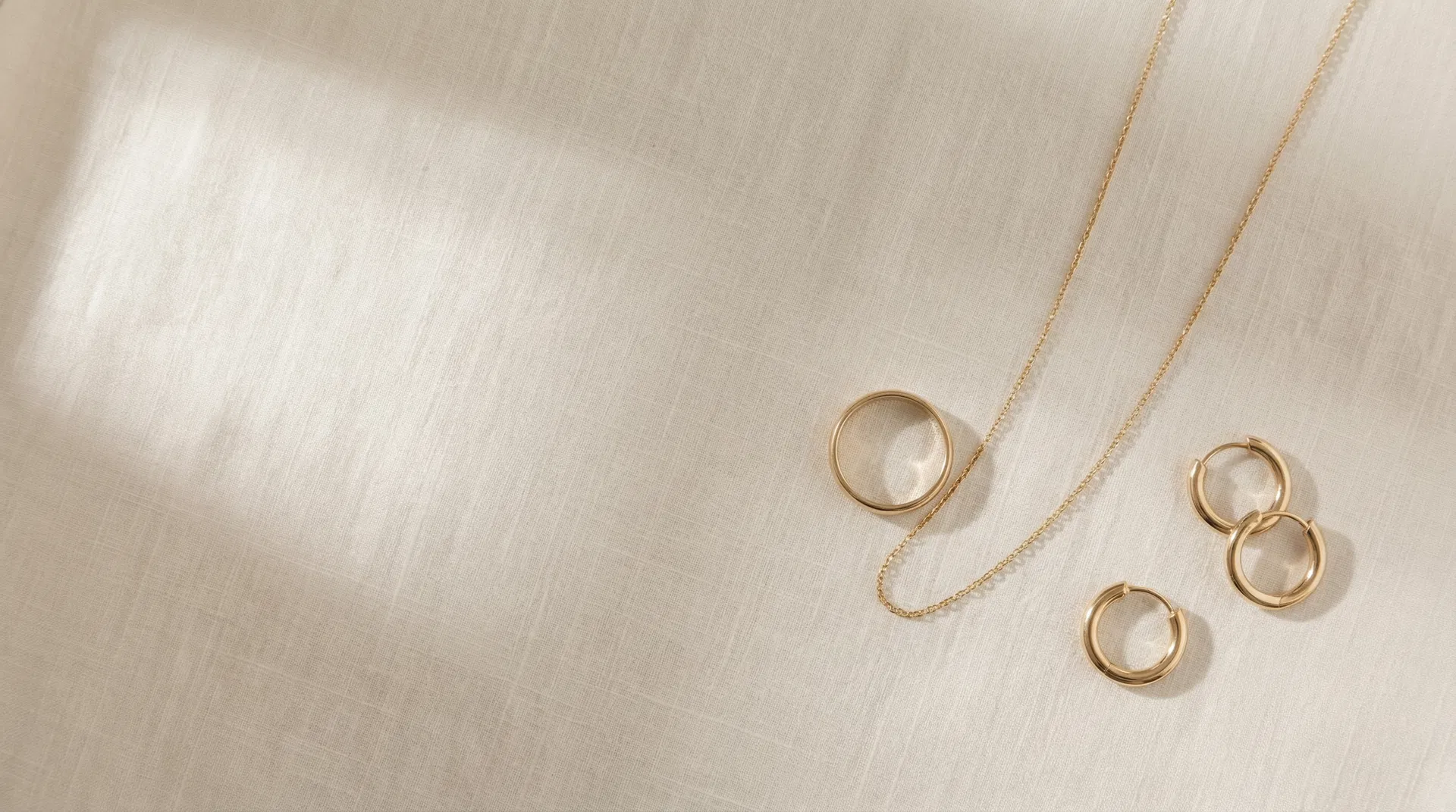 Fine gold jewelry on linen