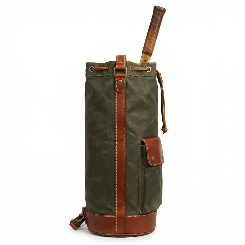 Vintage waxed canvas & leather tennis bucket backpack in navy blue - drawstring closure, racket compartment, brass hardware & leather shoulder strap - custom club logo available by Links Sports Co — view 3