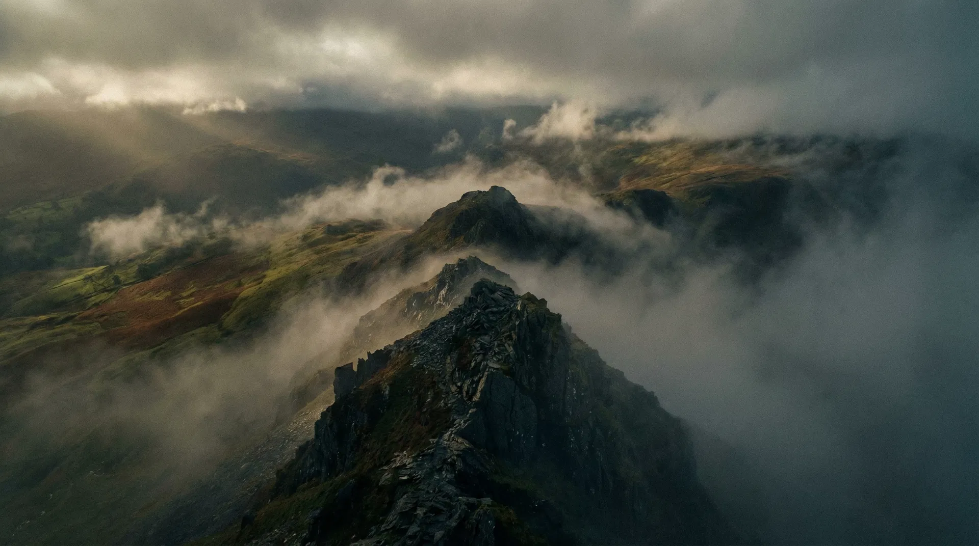 Dramatic mountain ridge in clouds