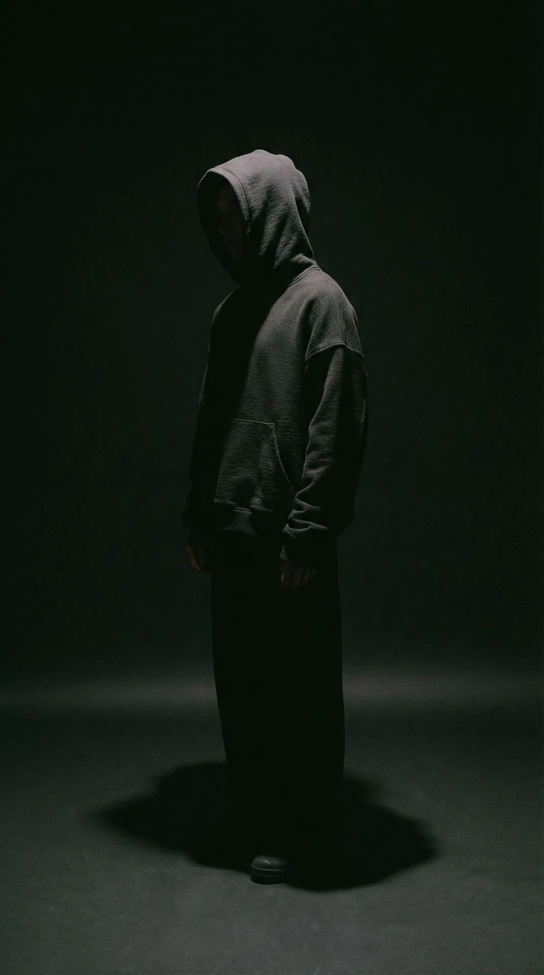 Unality streetwear editorial — dark hoodie silhouette