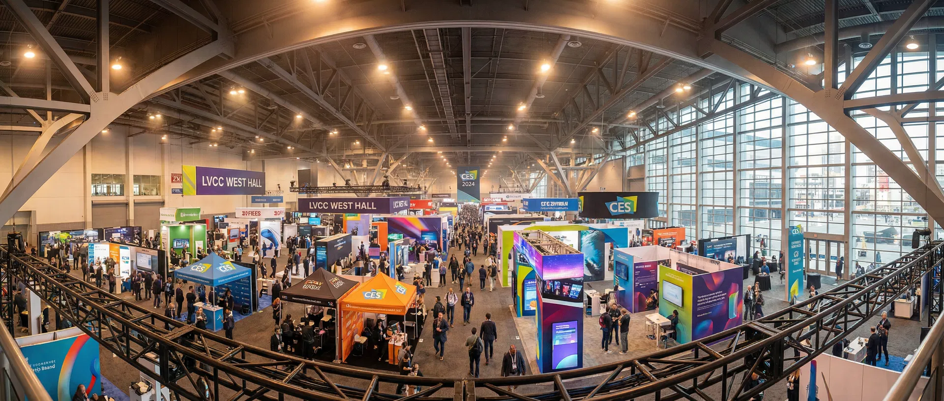 Trade show convention floor with island exhibits and LED video walls