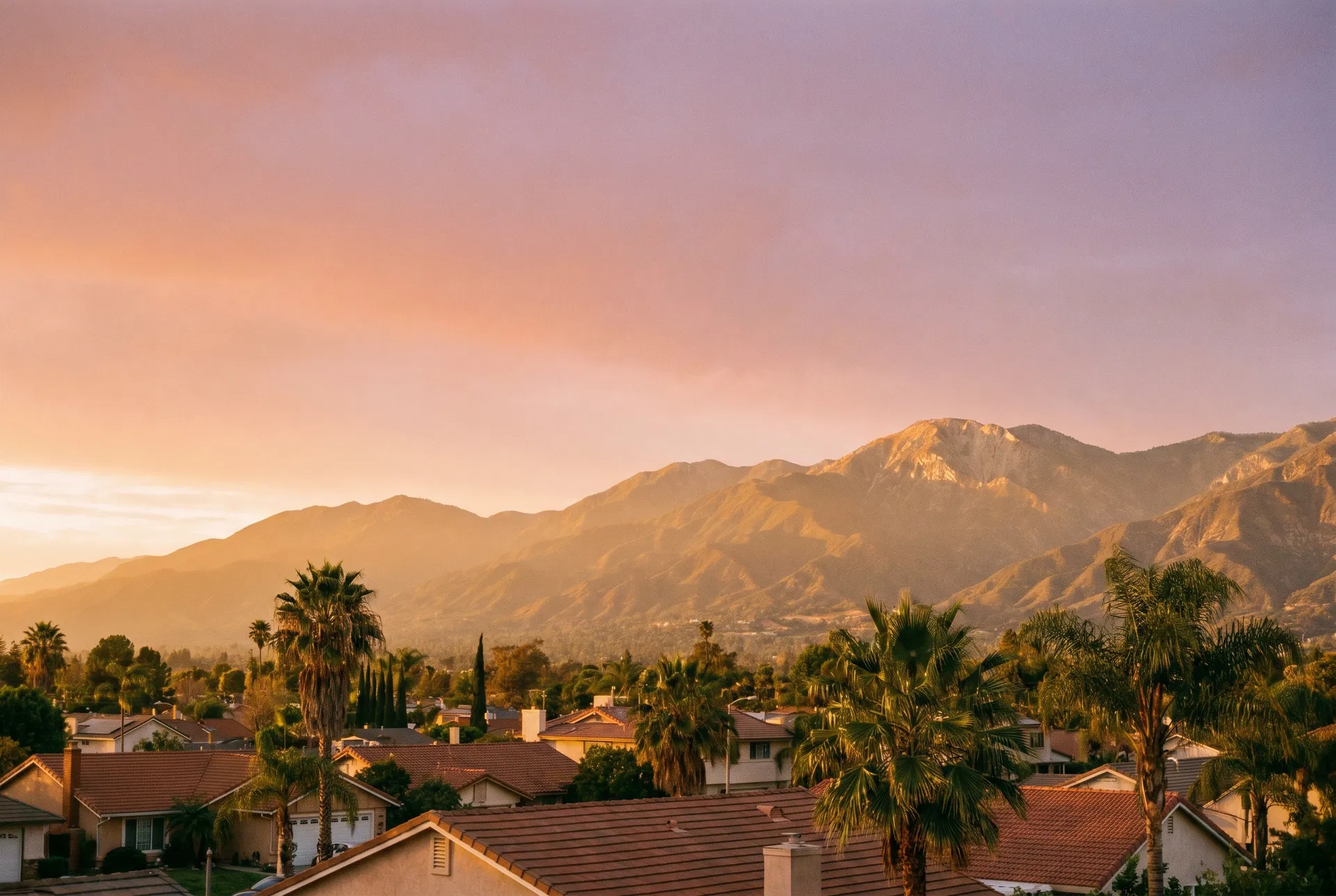 San Gabriel foothills behind an Azusa residential neighborhood at golden hour
