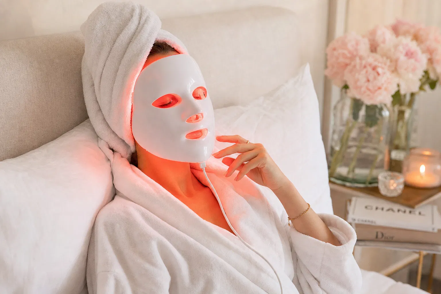 Woman relaxing with GlowRitual LED mask
