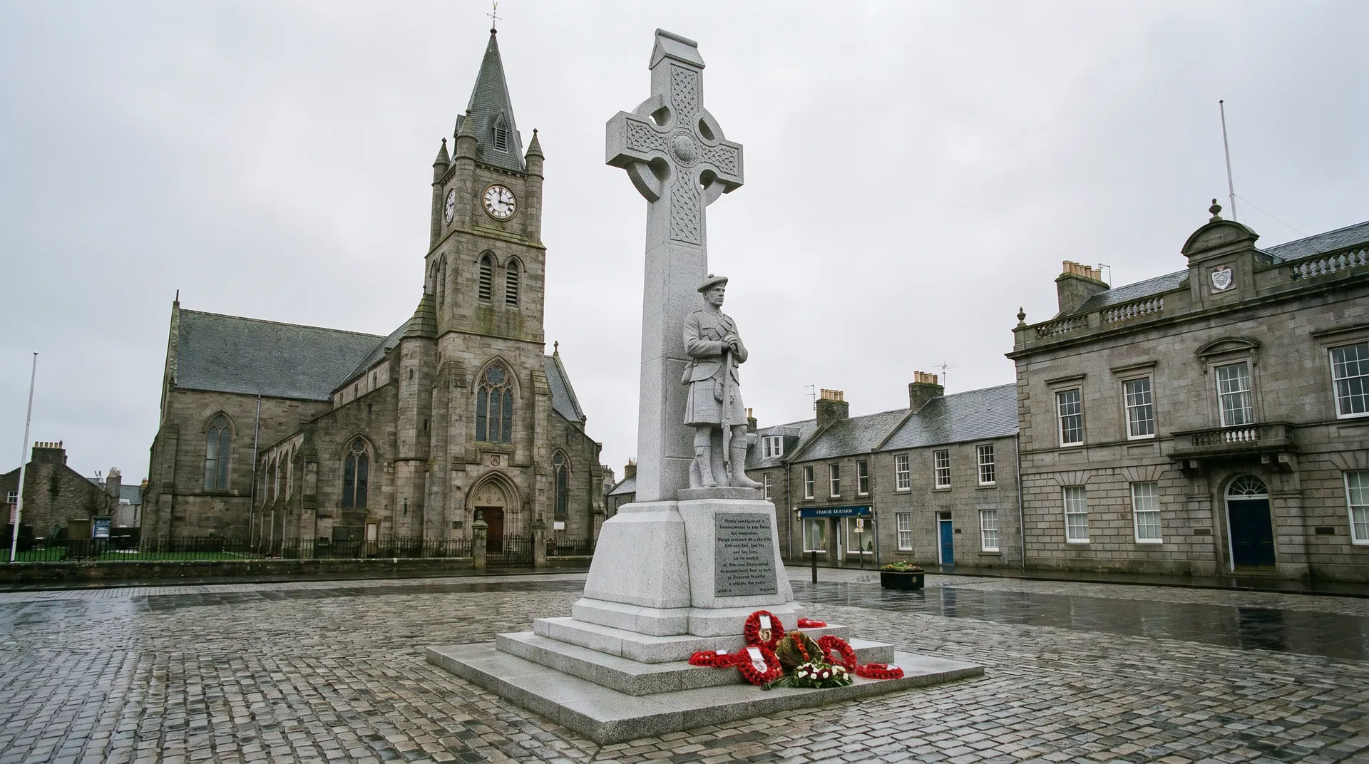 Restored war memorial in Scottish town square