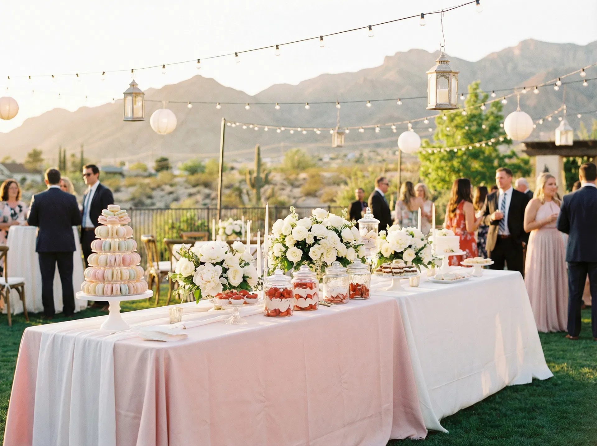 Elegant outdoor garden party in Westside El Paso TX with blush pink dessert table and floral centerpieces by Sweet & Sassy Party Planner