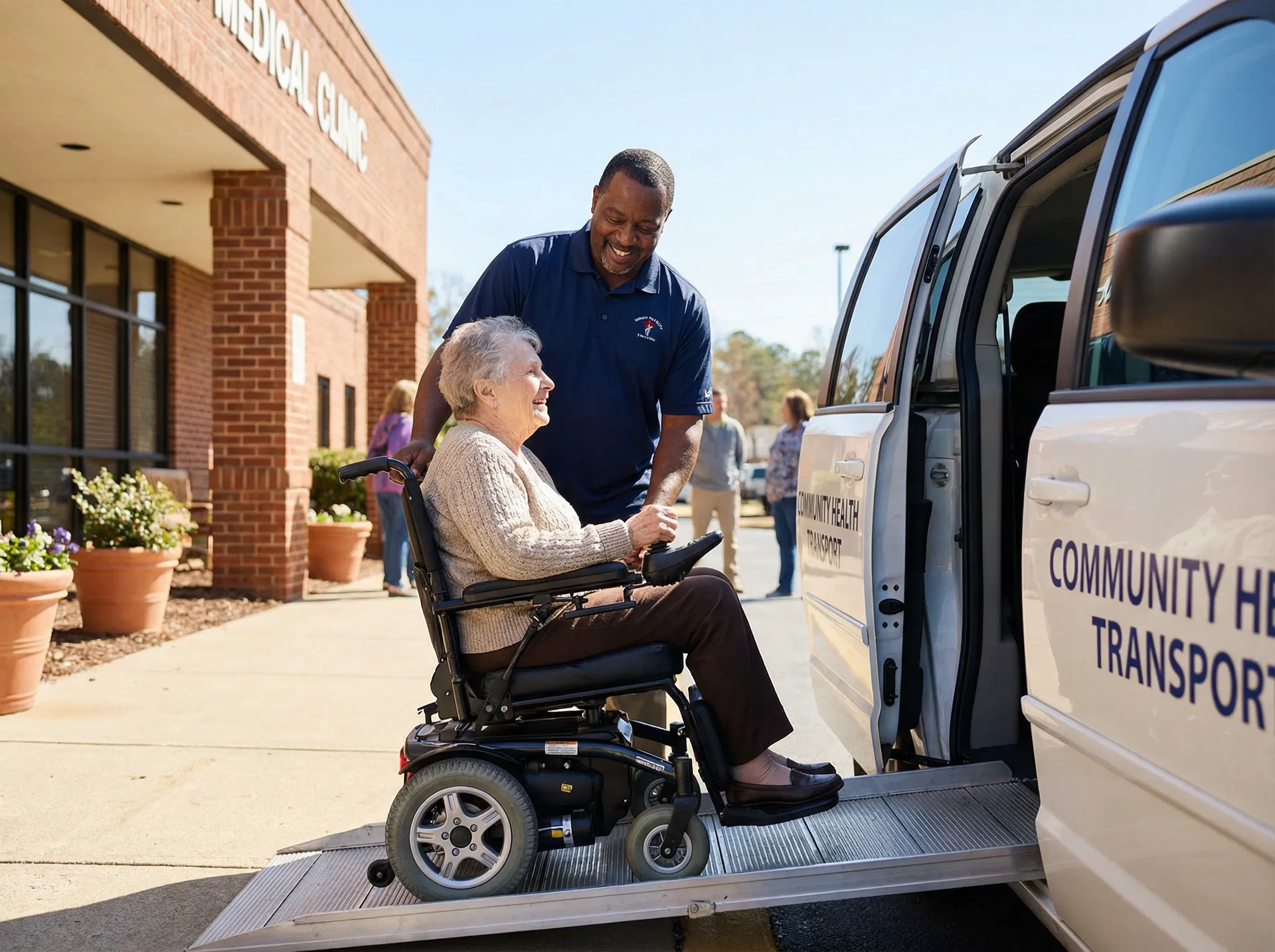 Professional driver helping patient board wheelchair accessible van