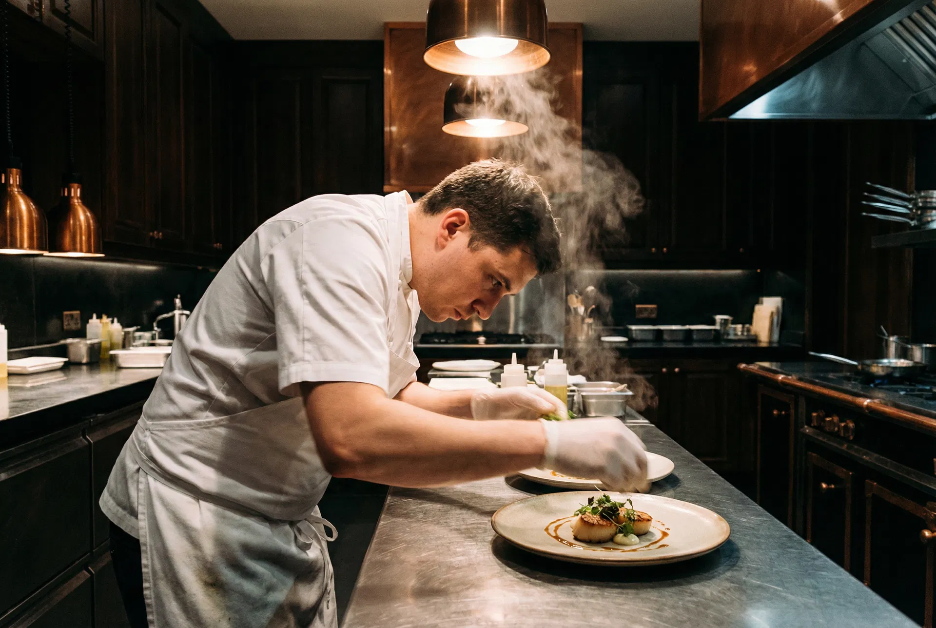 Professional chef plating an elegant dish