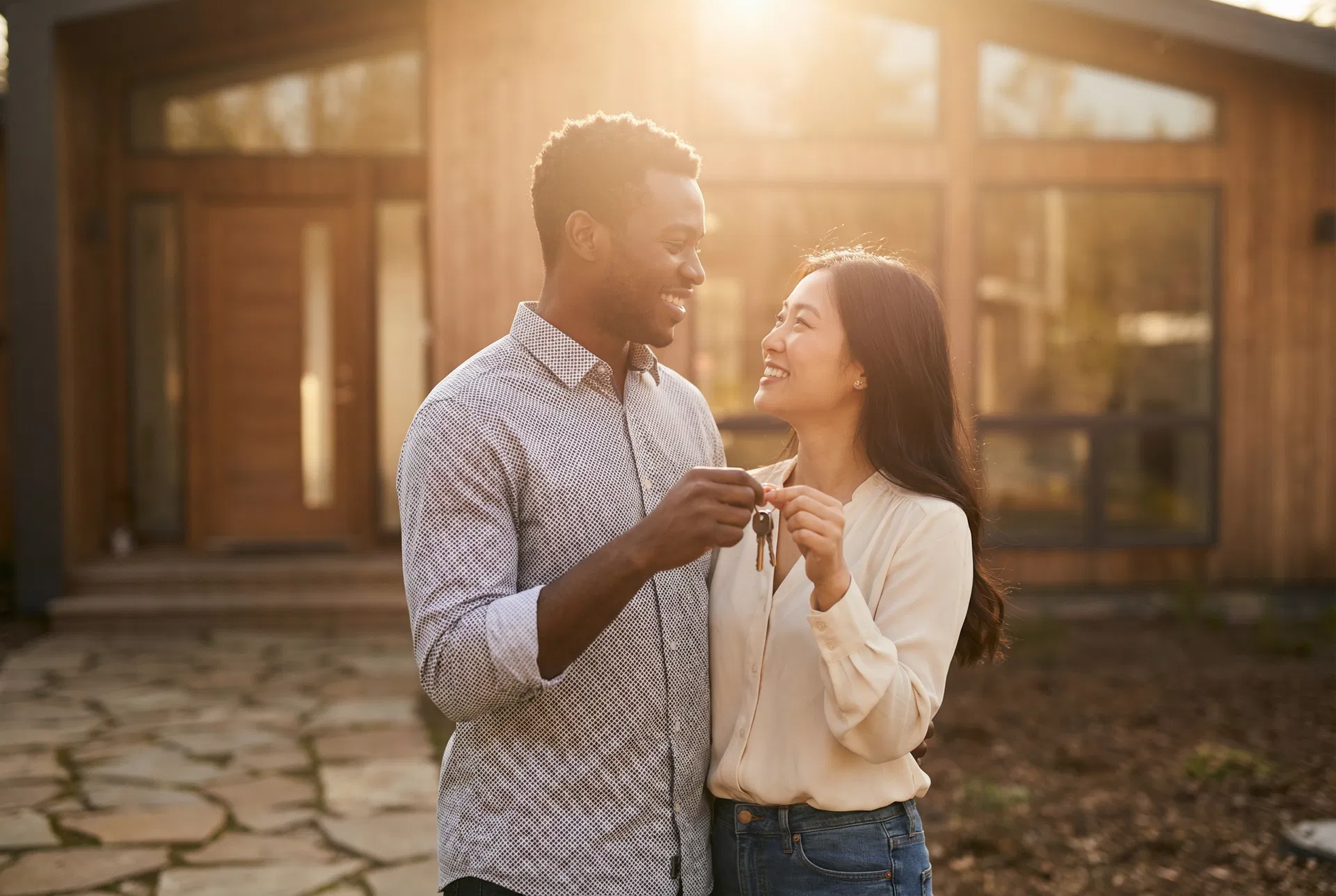 Happy couple with house keys