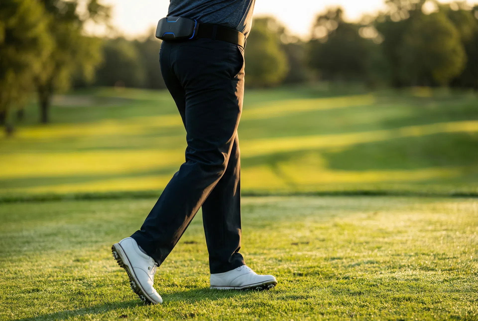 Close-up of the XIO Sports Assist belt on a golfer walking a fairway