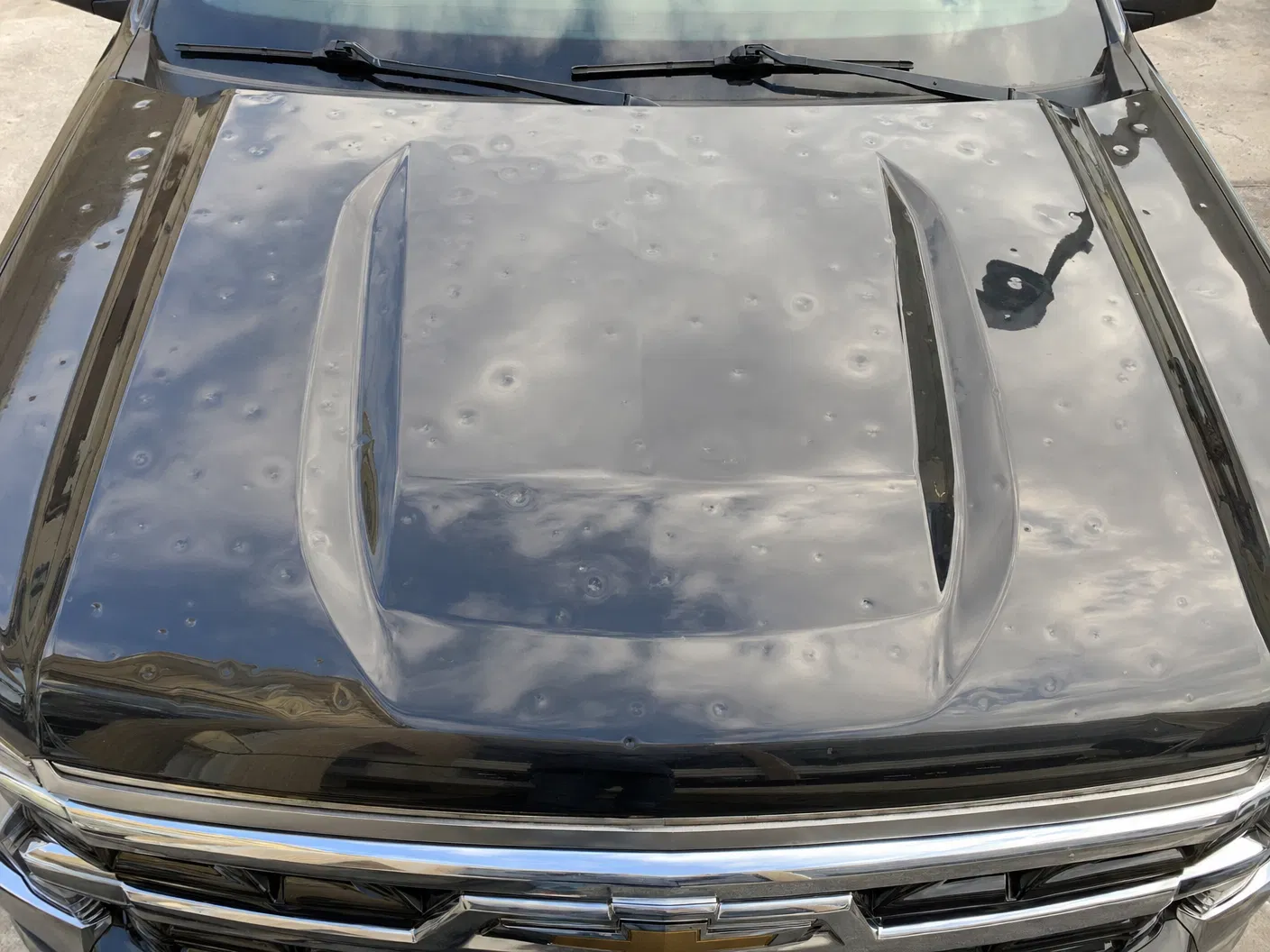Black Truck — Hood Hail Damage