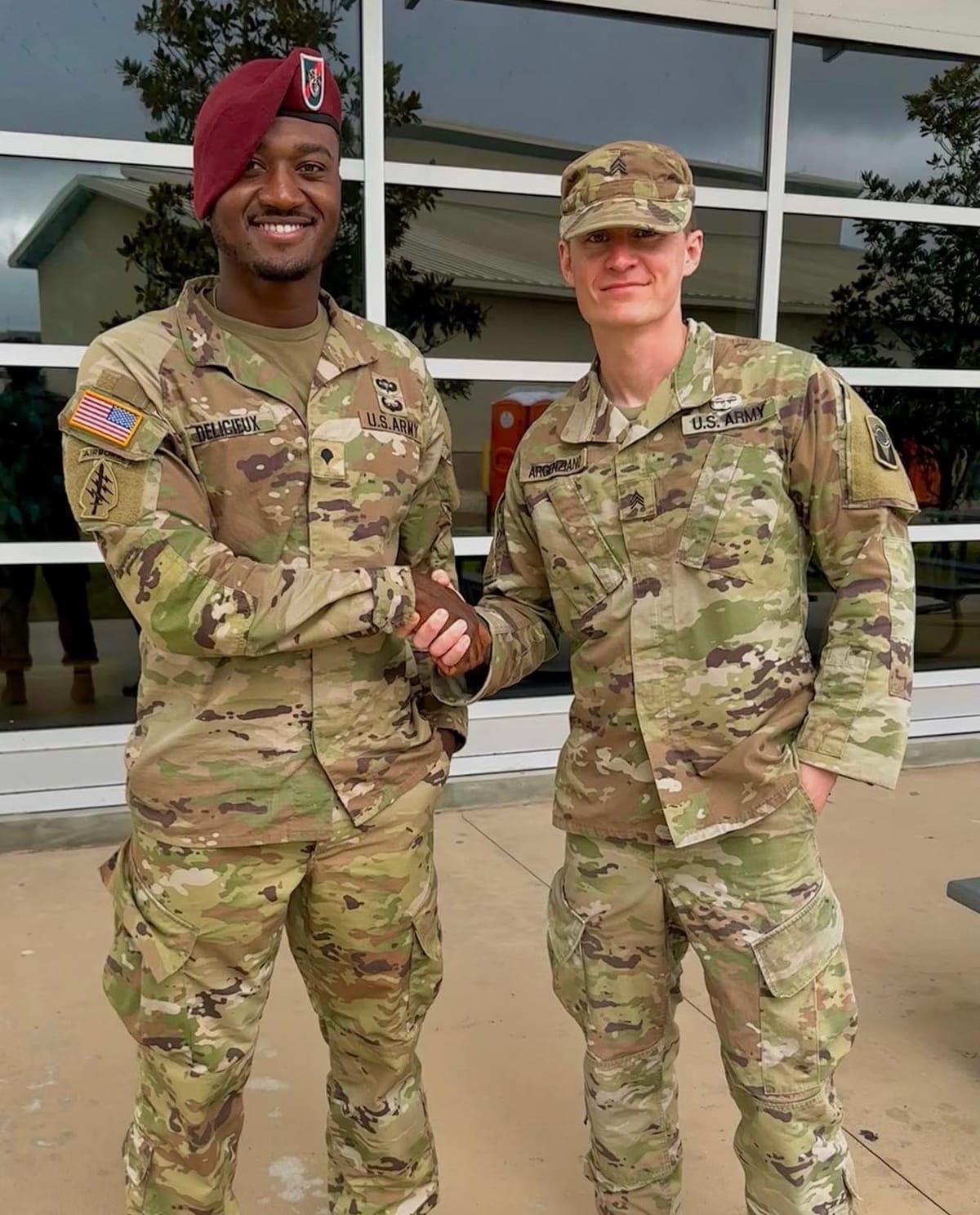 Drew Delicieux in U.S. Army uniform shaking hands