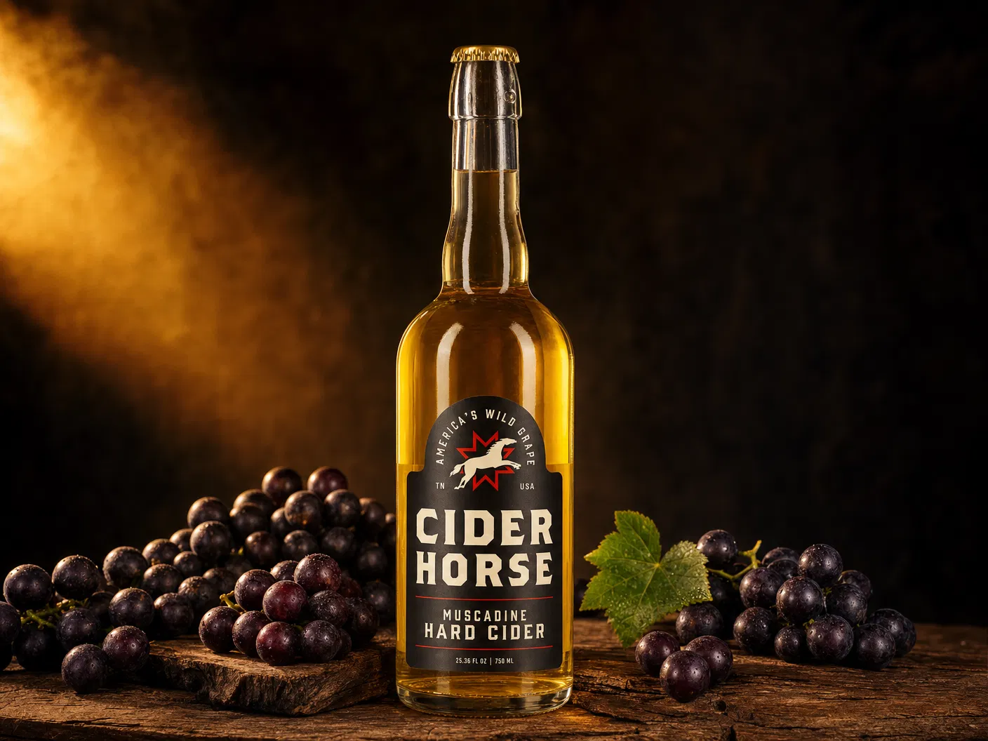 Cider Horse Muscadine Hard Cider 750mL bottle with dark label surrounded by fresh muscadine grape clusters on a rustic wood surface