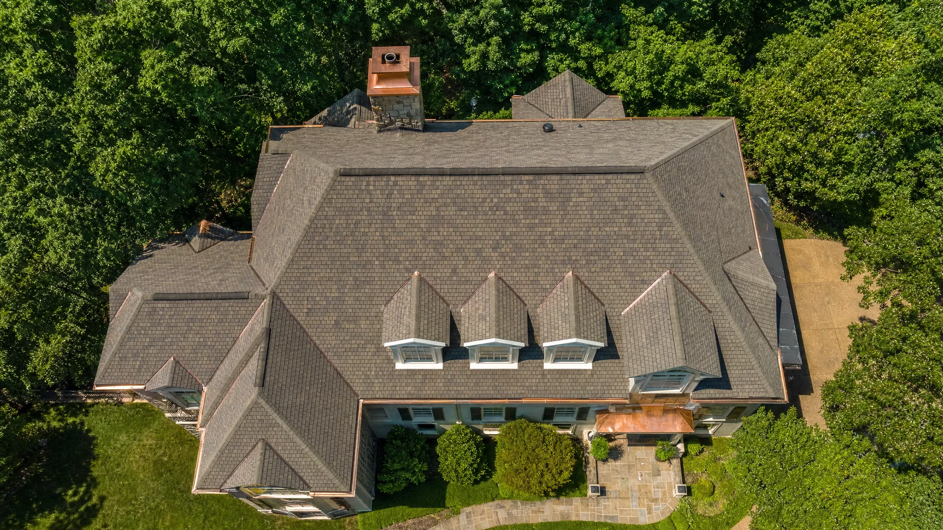 Aerial drone photograph of a residential rooftop in Brentwood Tennessee showing shingle detail