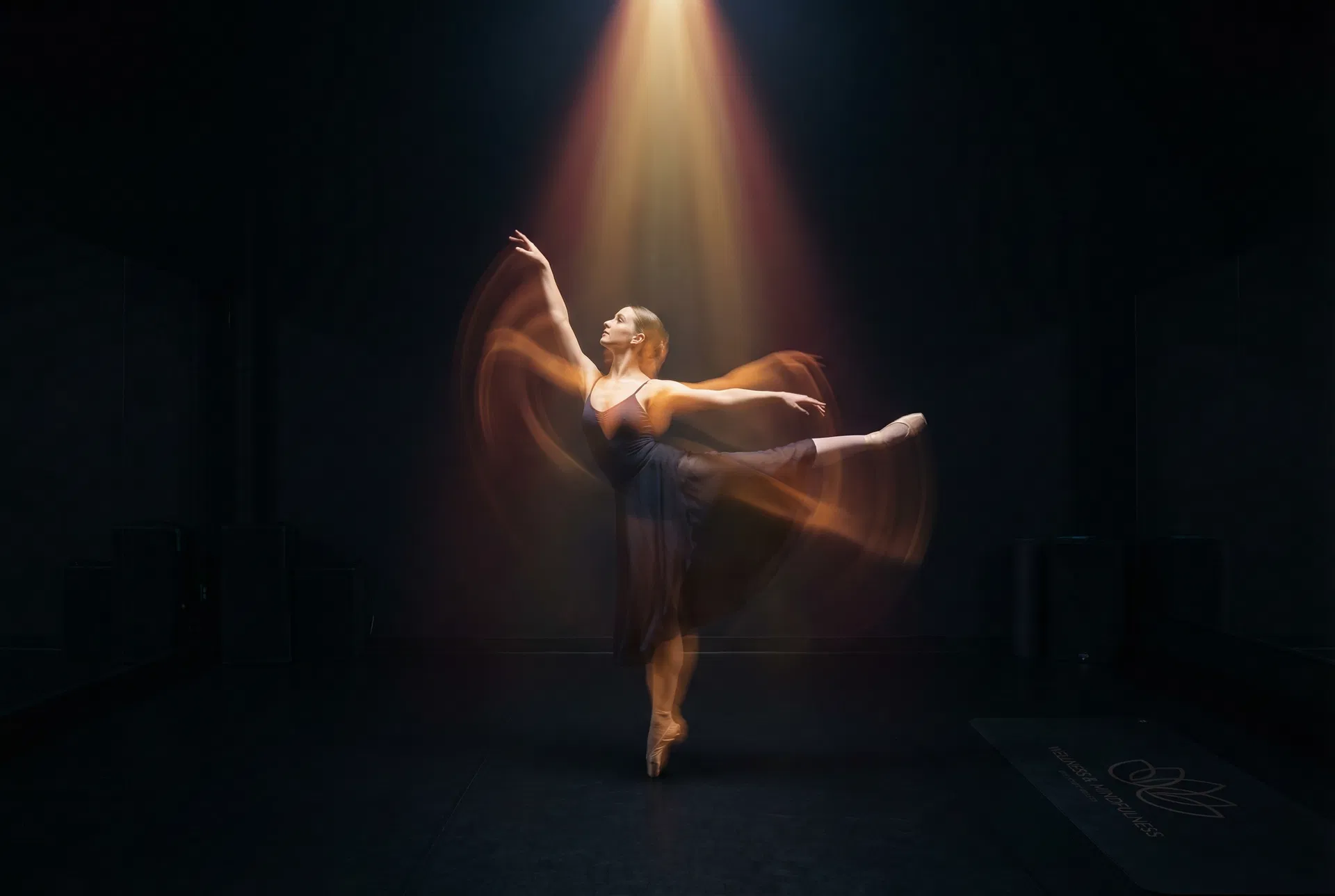 Ballet dancer under spotlight