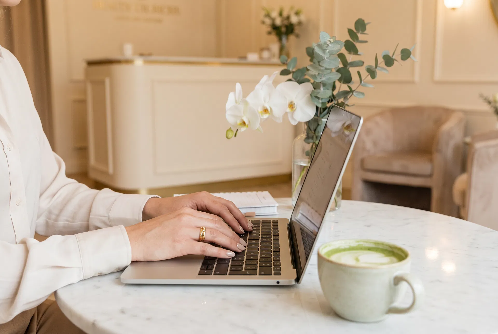 Elegant woman working at a med spa reception desk