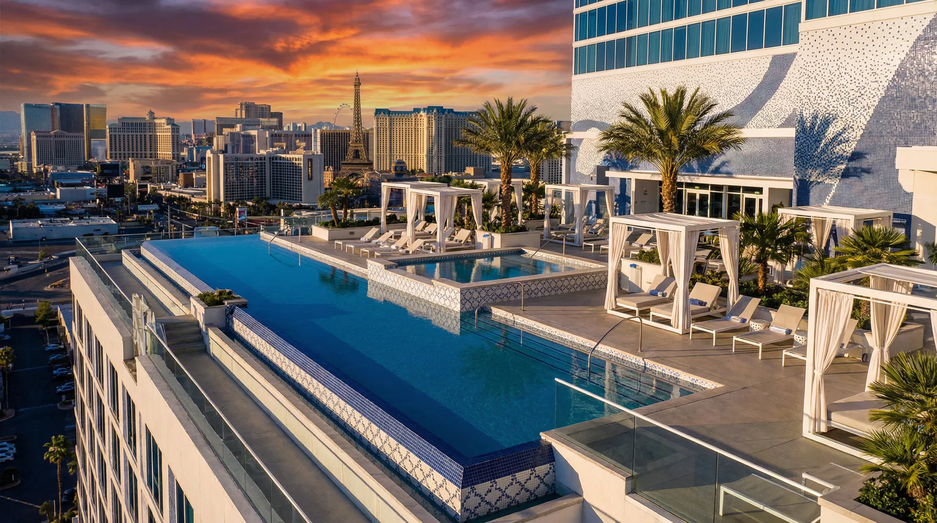 Fontainebleau Las Vegas rooftop infinity pool with Strip skyline at sunset