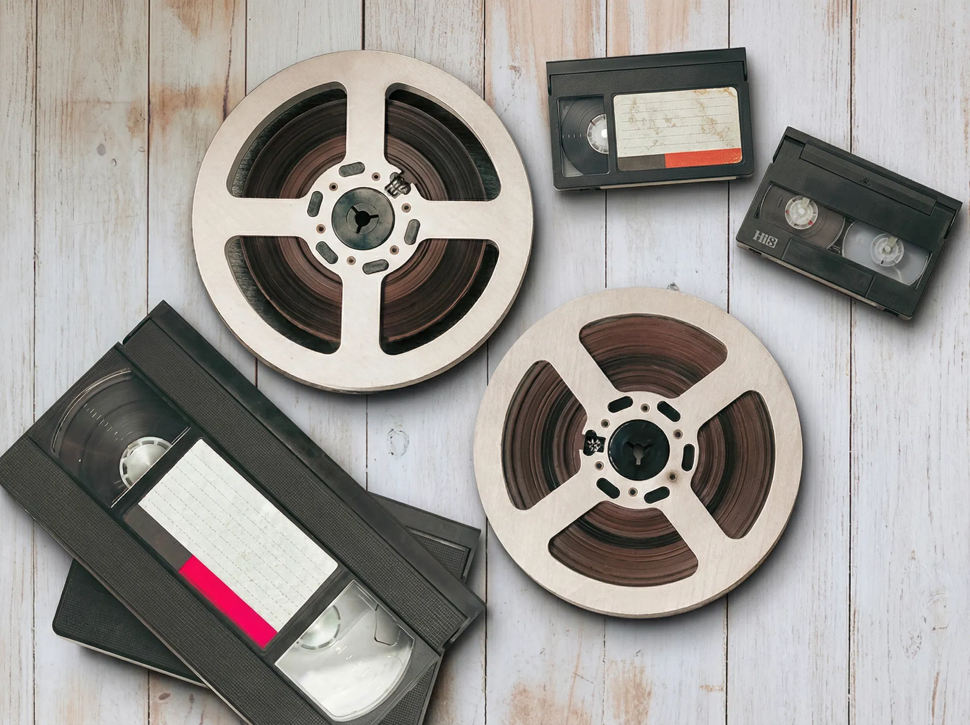 VHS tapes and cine film reels ready for digital transfer to DVD or USB at Canvas Printing Co Ltd Poole