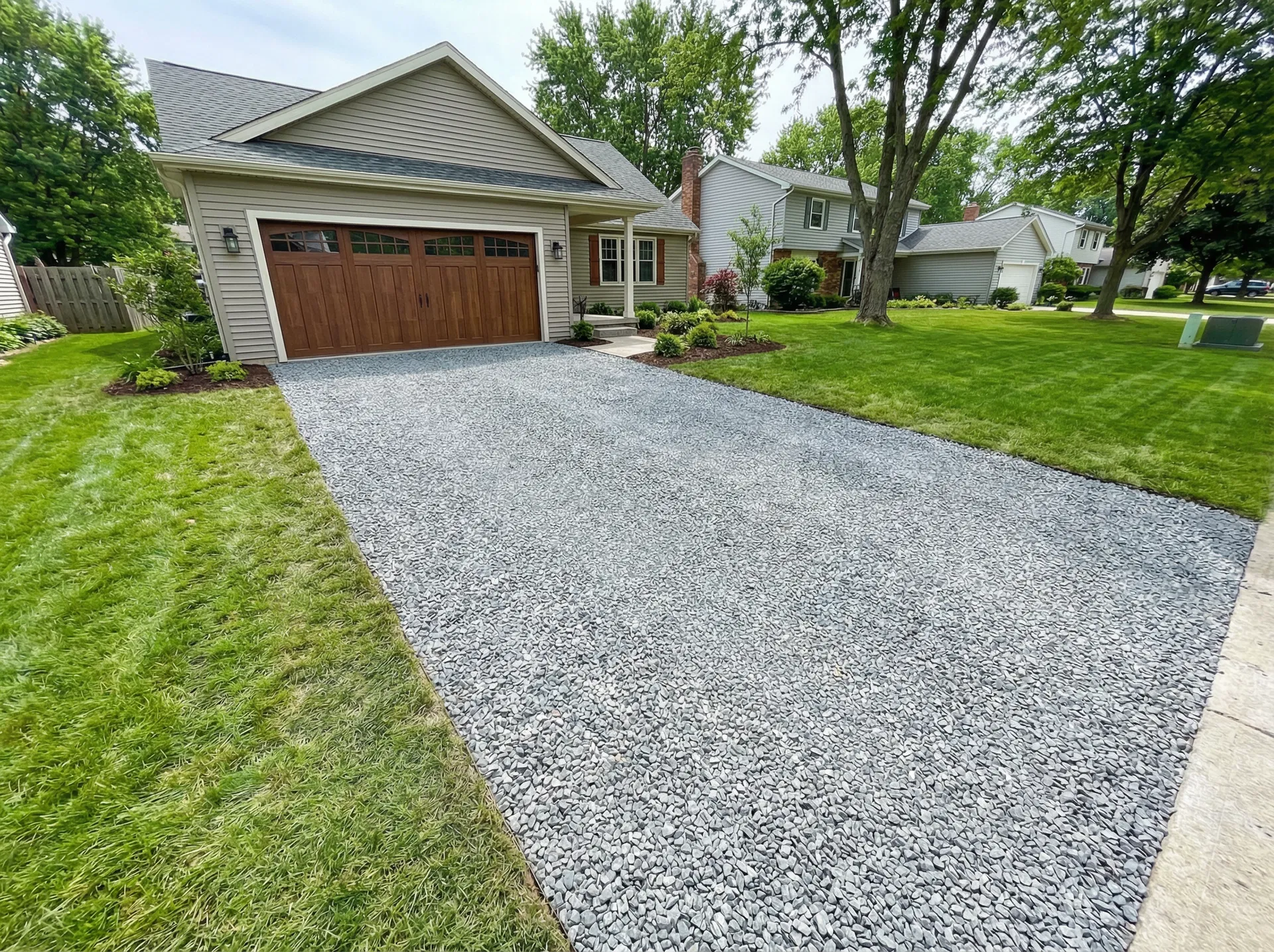 Crushed limestone driveway in a suburban neighborhood