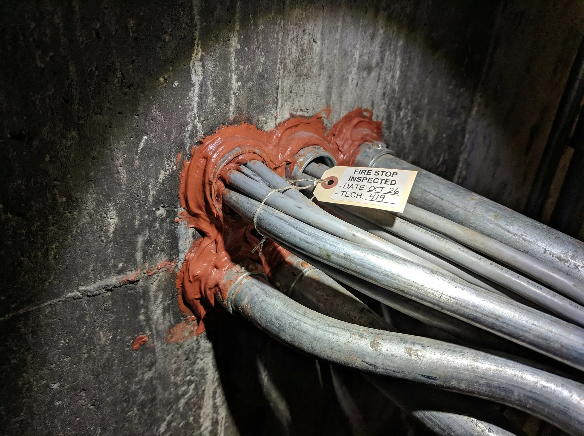 Firestopping inspection — cable penetration with fire-rated sealant