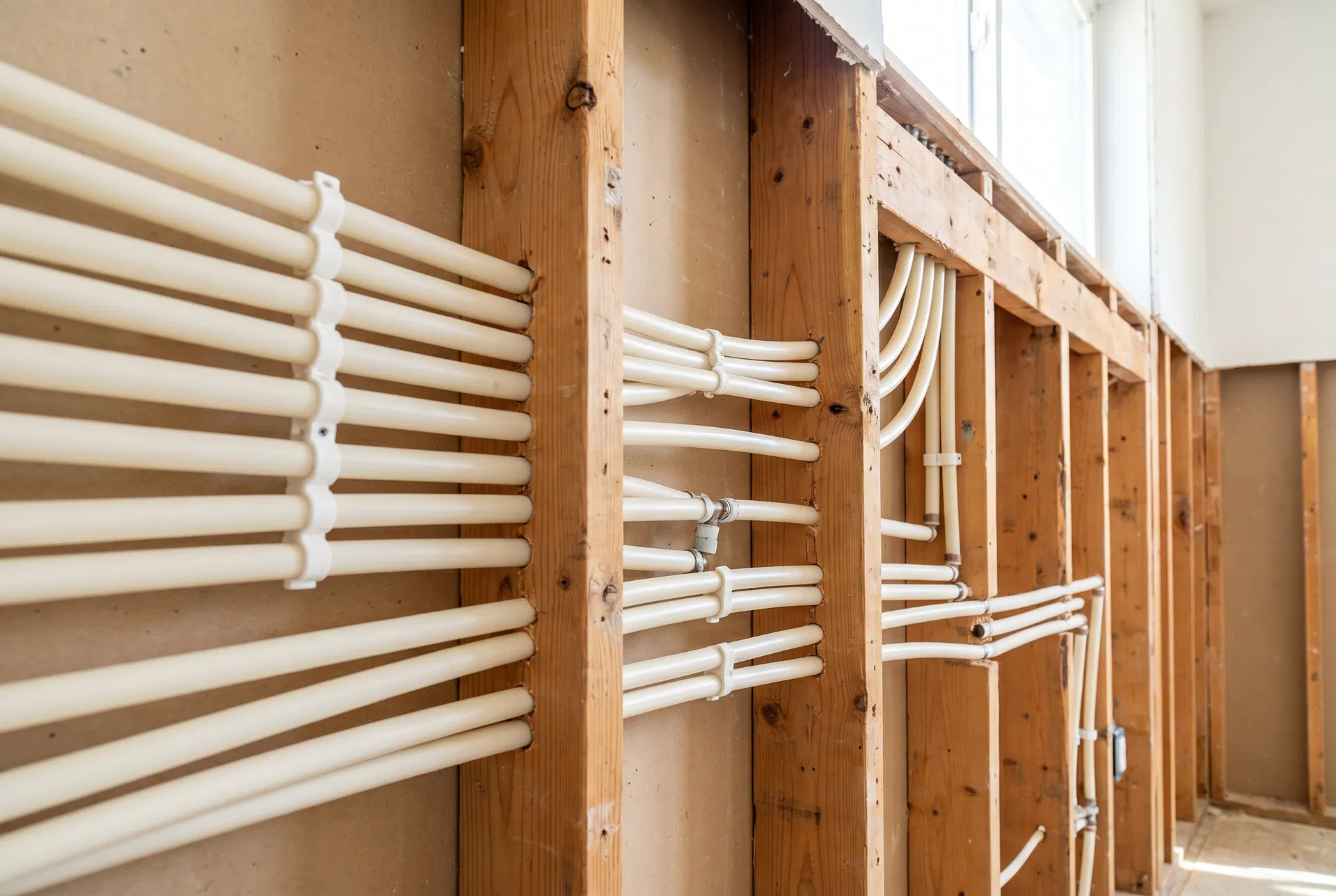 PEX repiping installation in wall framing during whole-house repipe by C.S.W. Power Solutions in San Antonio