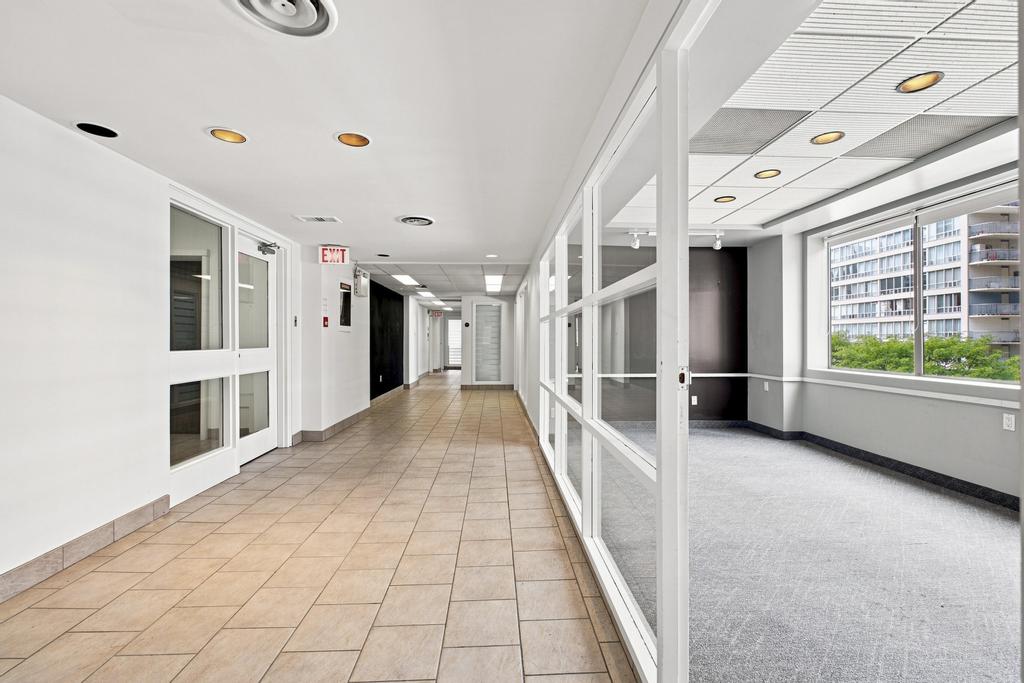 Glazed private offices and corridor at 51 Eglinton Avenue East