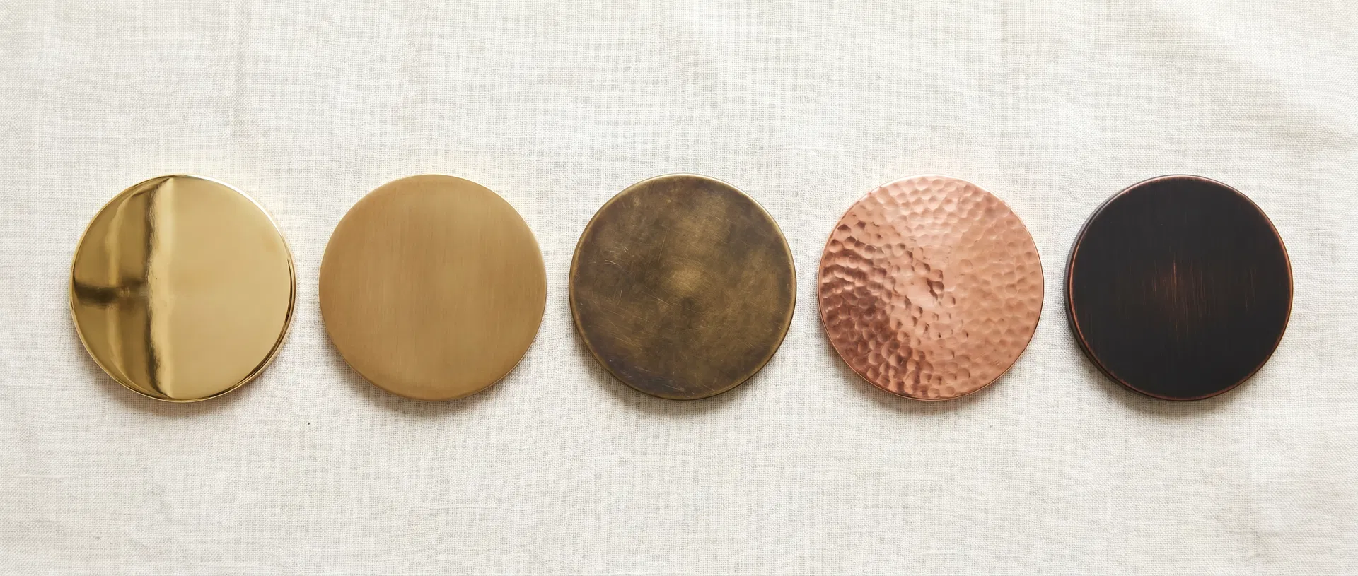 Five brass and copper finish samples