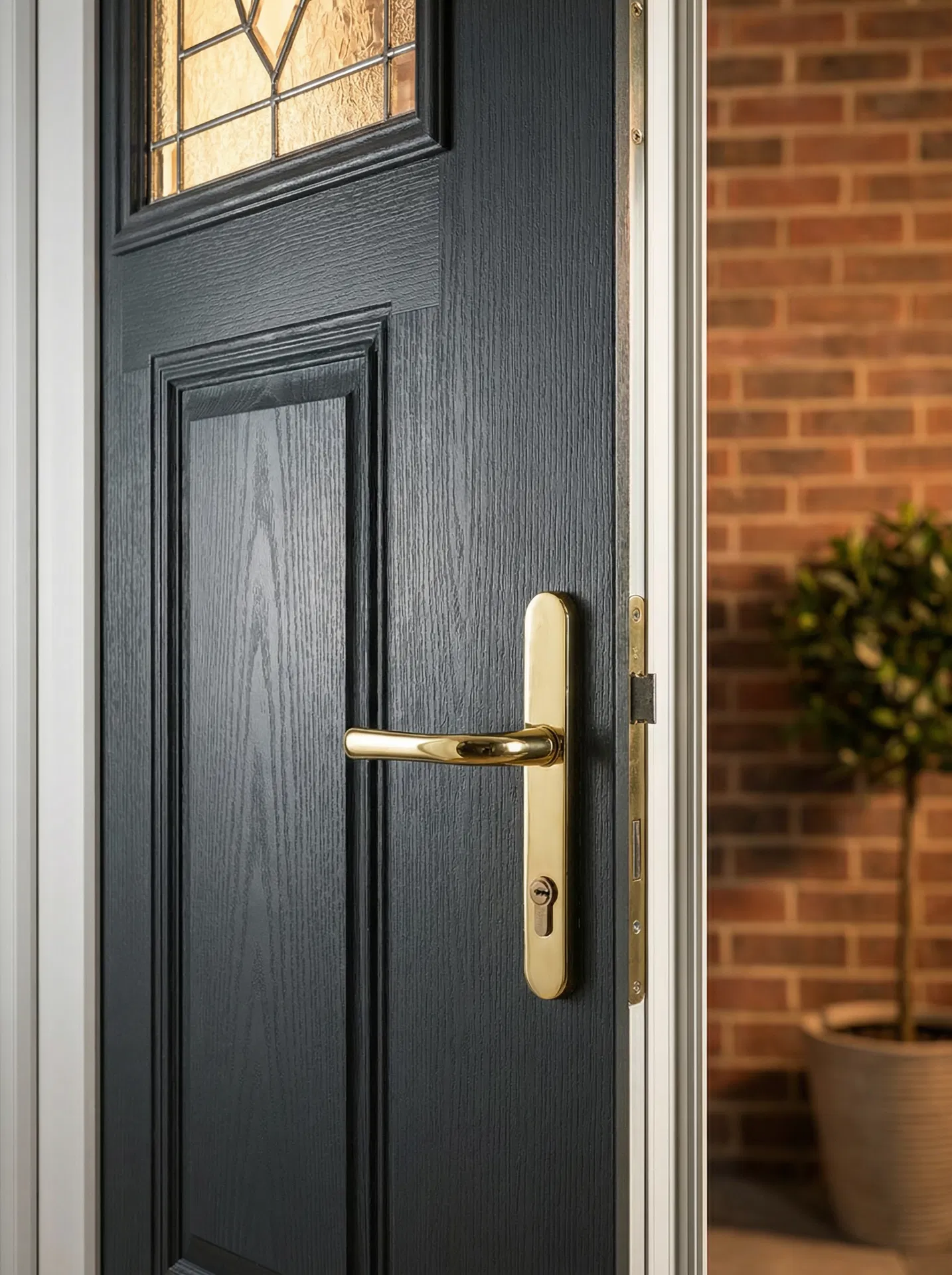 Premium composite front door with decorative glazing cassette installed on a traditional Lincolnshire home by Pilgrim uPVC Specialists