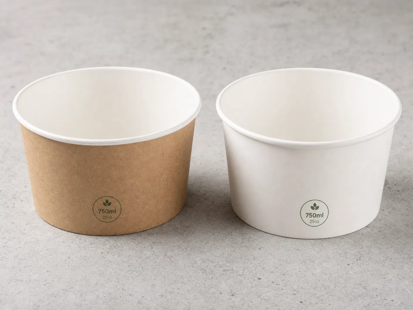 Side-by-side comparison of kraft brown paper bowl and white paper bowl, both 750ml size on gray concrete surface