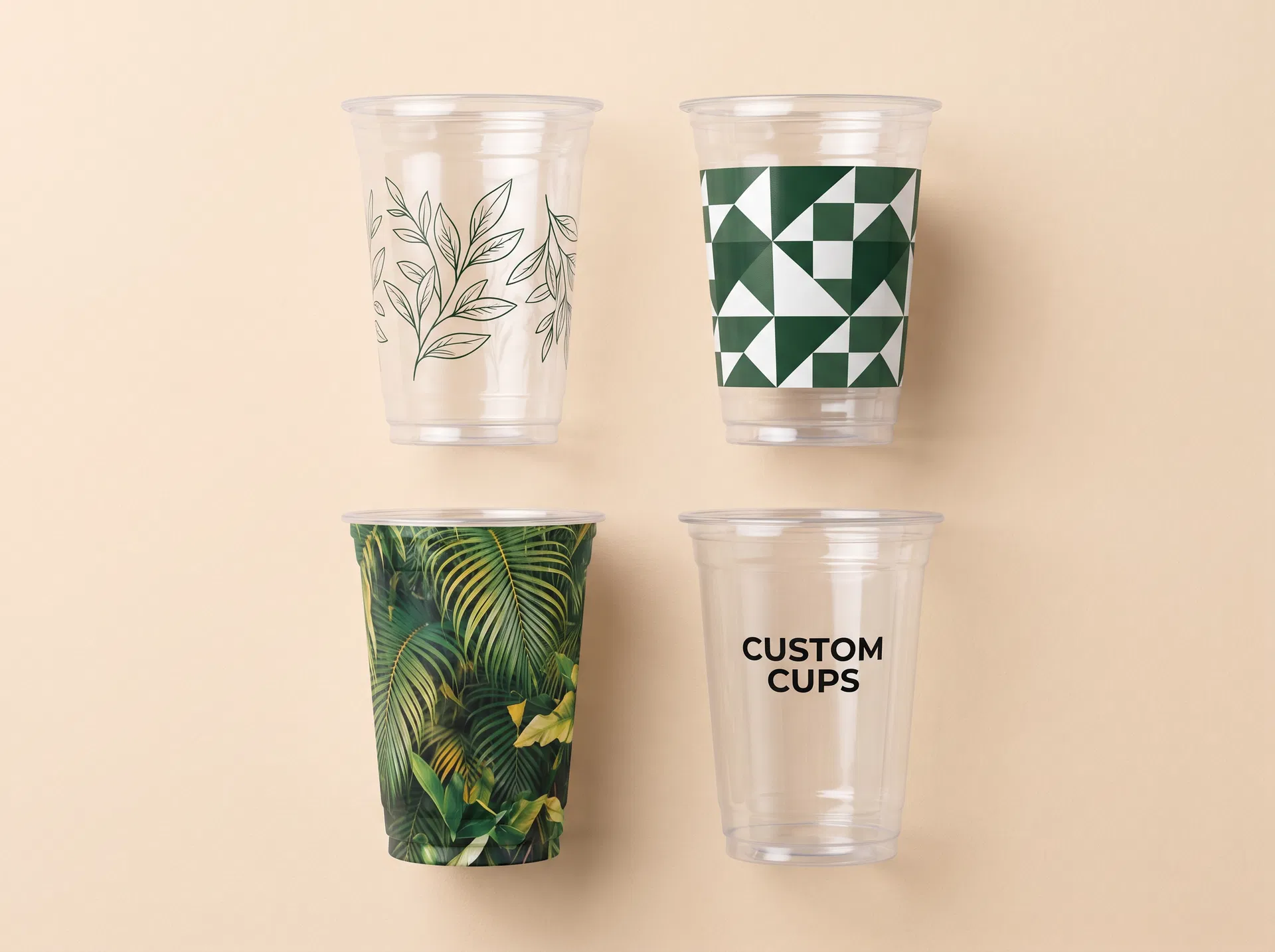 Custom printed PET cups -- 4 different printing styles: botanical line art, geometric pattern, tropical full-wrap print, and wordmark logo on crystal-clear PET cups