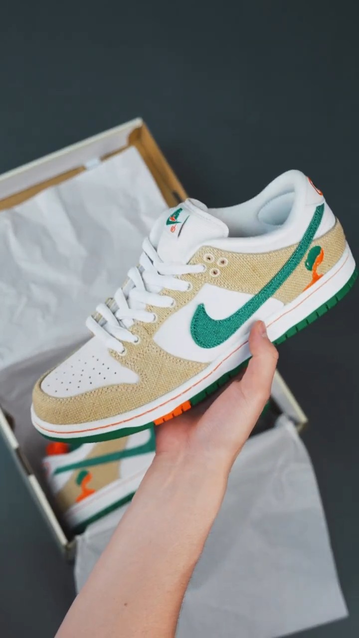 Nike Dunk Low white, tan, green, orange sneakers — perforated toe box, embroidered green swoosh, tan canvas panels, orange and green outsole accents, embroidered snake graphic on heel